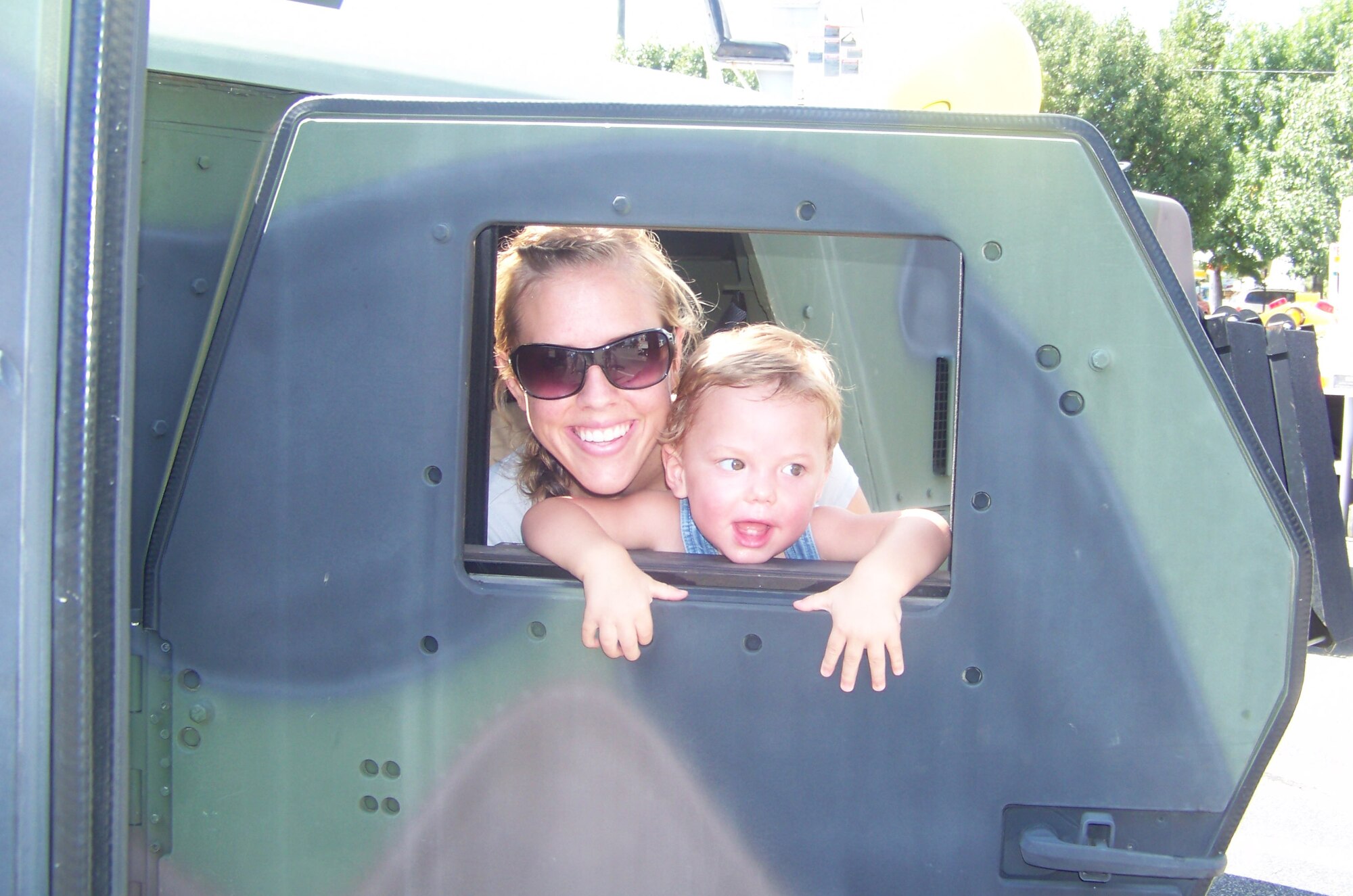 Sarah Lazane and her son, Mavrik, enjoy one of the many vehicles showcased at Destin's Big Truck Day. Hurlburt Field sent three of their most unique vehicles to the event, attended by hundreds of Okaloosa County residents. The event is held annually at the Destin Community Center (U.S. Air Force photo).