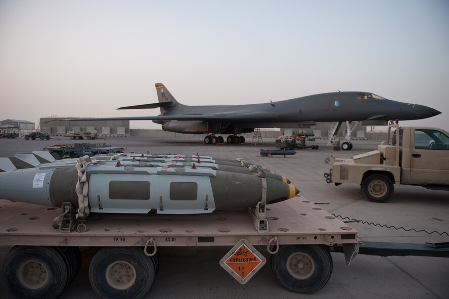 A B-1B Lancer is parked on the flightline in Southwest Asia, August 13. Carrying the largest payload of both guided and unguided weapons in the Air Force inventory, the multi-mission B-1 is the backbone of America's long-range bomber force. (U.S. Air Force/Staff Sgt. Robert Barney)