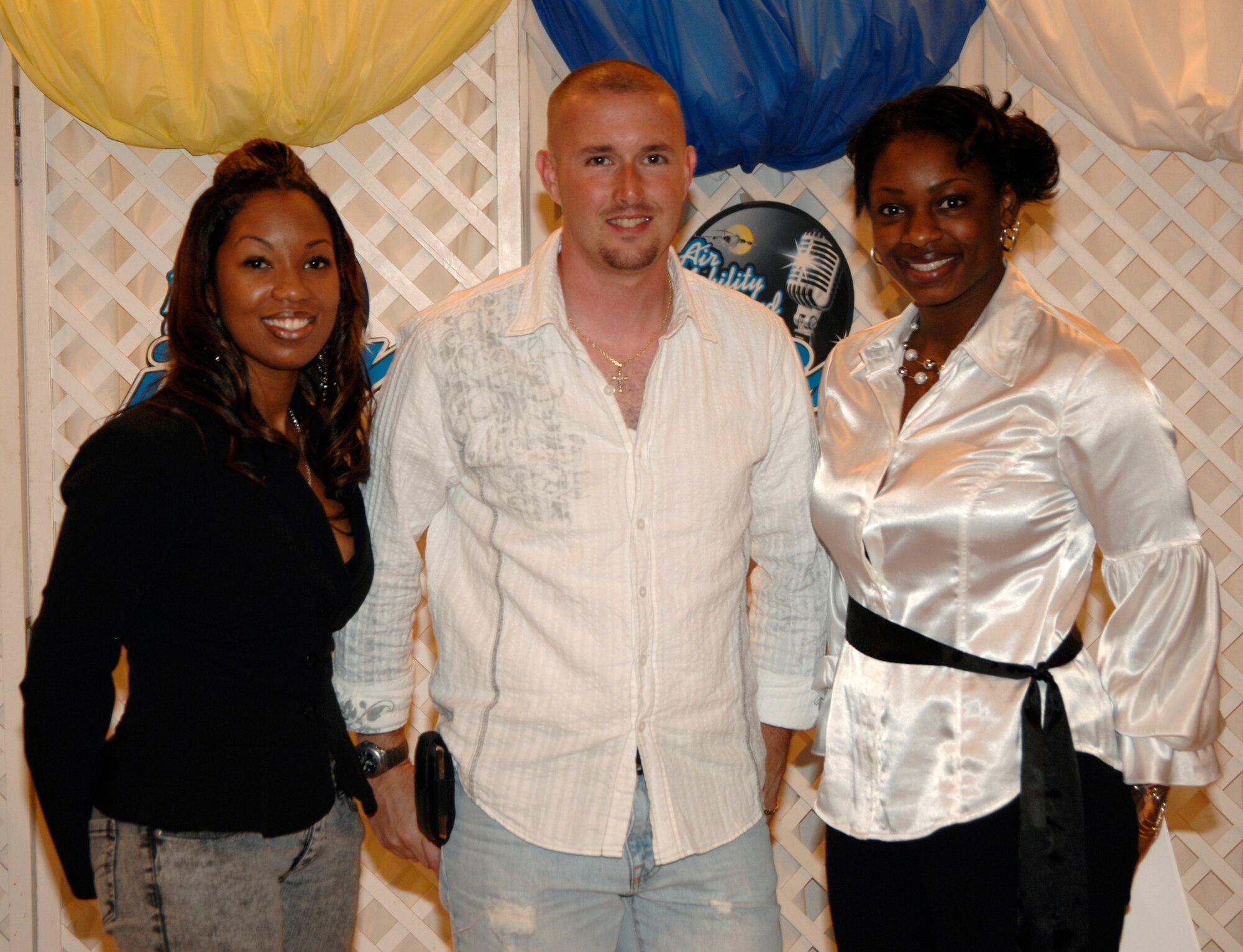 Senior Airman Anisa Lavine, 22nd Operations Support Squadron, Staff Sgt. Doug Boren, 384th Air Refueling Squadron, and Tech. Sgt. Schavonne Wilson, 931st Air Refueling Group, take the stage as McConnell’s Idol program winners, Aug. 7. Sergeant Boren won first place in the singing contest at McConnell Air Force Base, Kan., and will compete in the Air Mobility Command Idol at Scott AFB, Ill. (U.S. Air Force photo/Senior Airman Laura Suttles)