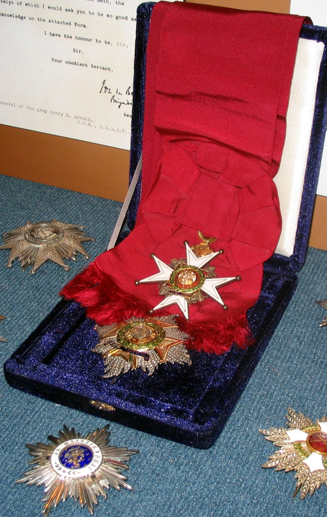 General Arnold's "Most Honourable Order of the Bath, Knight Grand Cross" - Badge and Star (center) awarded by King George VI of England is probably the most well-known of the general's international awards and decorations for his service in World War II.