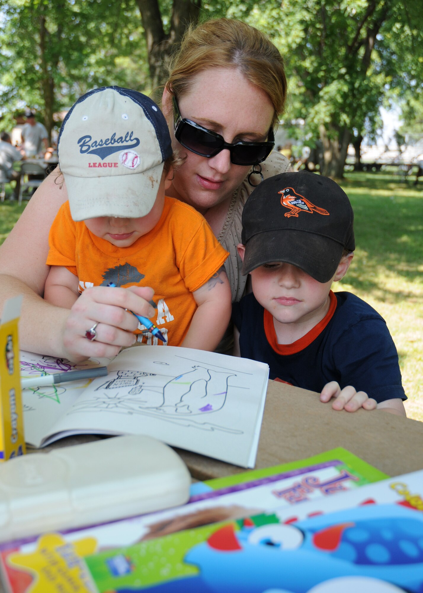 Tech. Sgt. Jessical Hamilton, 512th Maintenance Operations Flight, spends time with her sons, Cody, 1, and Colton, 3, during the 512th Airlift Wing bi-annual picnic Aug. 1. More than 1,200 reservists and their families attended the event, which was held at the Eagle's Nest Picnic Area on Dover Air Force Base. The next wing picnic is scheduled for the summer of 2011. (U.S. Air Force photo/Capt. Marnee A.C. Losurdo)