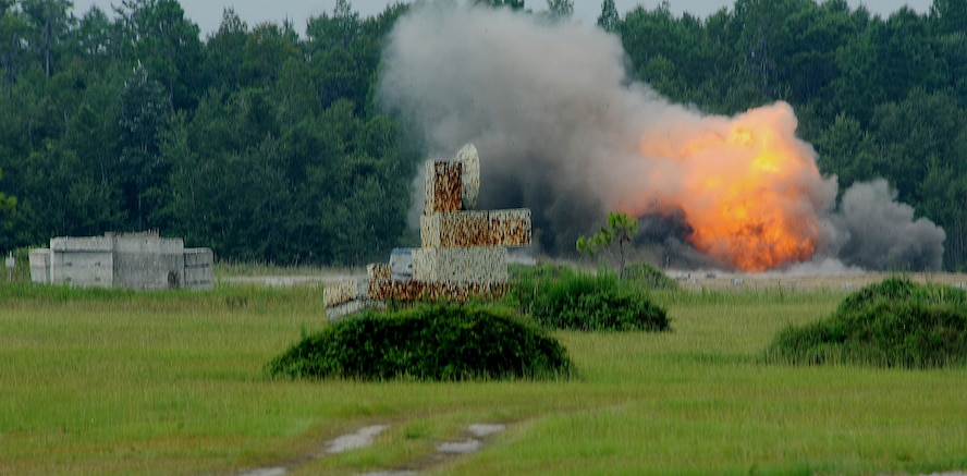 MOODY AIR FORCE BASE, Ga. -- Explosives rigged by the 23rd Civil Engineer Squadron Explosive Ordnance Disposal team, explode during a Bronze Star Medal award ceremony here Aug. 14. Capt. Robert Scott, 23rd CES EOD flight commander, and Master Sgt. Michael Laskowski, 23rd CES EOD superintendent, were presented a Bronze Star Medal during the ceremony. (U.S. Air Force photo by Airman 1st Class Joshua Green)