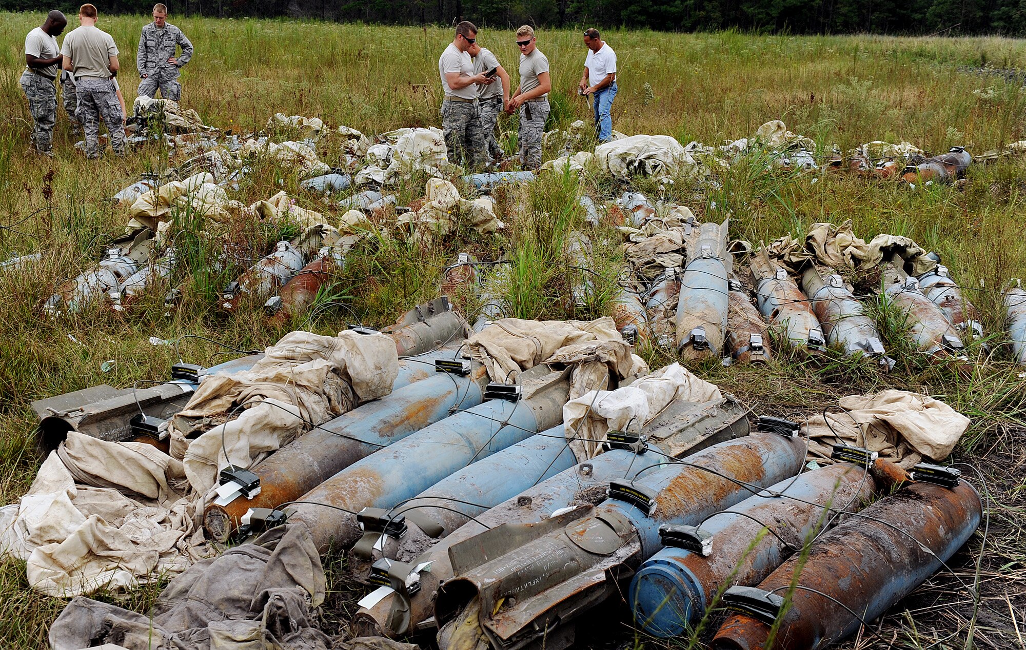 MOODY AIR FORCE BASE, Ga. -- Airmen from the 23rd Civil Engineer Squadron Explosive Ordnance Disposal team rig military high-explosives that will be used during a Bronze Star Medal presentation ceremony held here Aug. 14. Master Sgt. Michael Laskowski, 23rd CES EOD superintendent, and Capt. Robert Scott, 23rd CES EOD flight commander, were presented a Bronze Star Medal during the ceremony. (U.S. Air Force photo by Airman 1st Class Joshua Green)