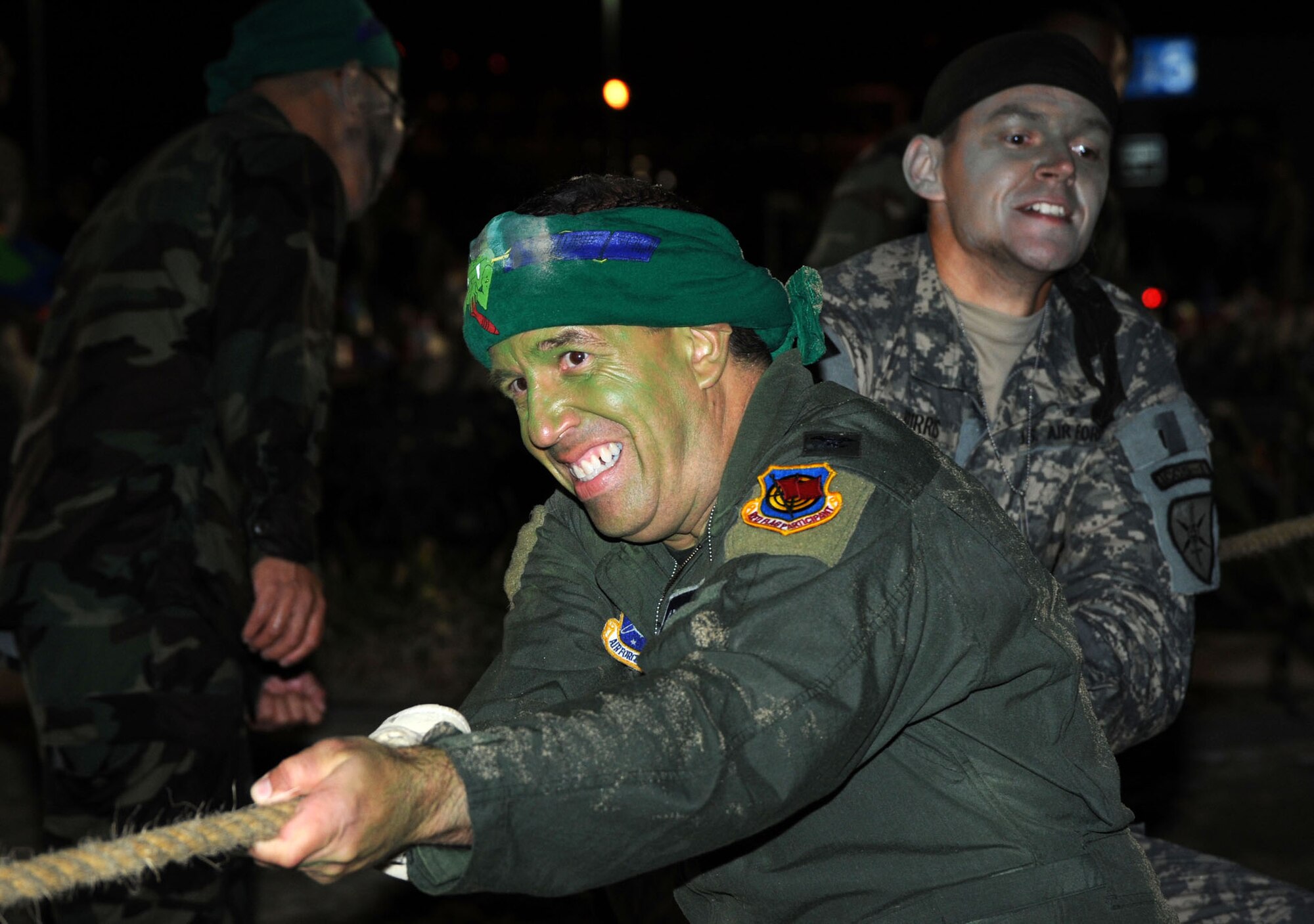 Col.  Carl Frushon, GPS Wing vice commander, and Capt. Ryan Burris put their muscle into the tug of war competition during the SMC Combat Dining In, Aug. 7.  (Photo by Lou Hernandez)
