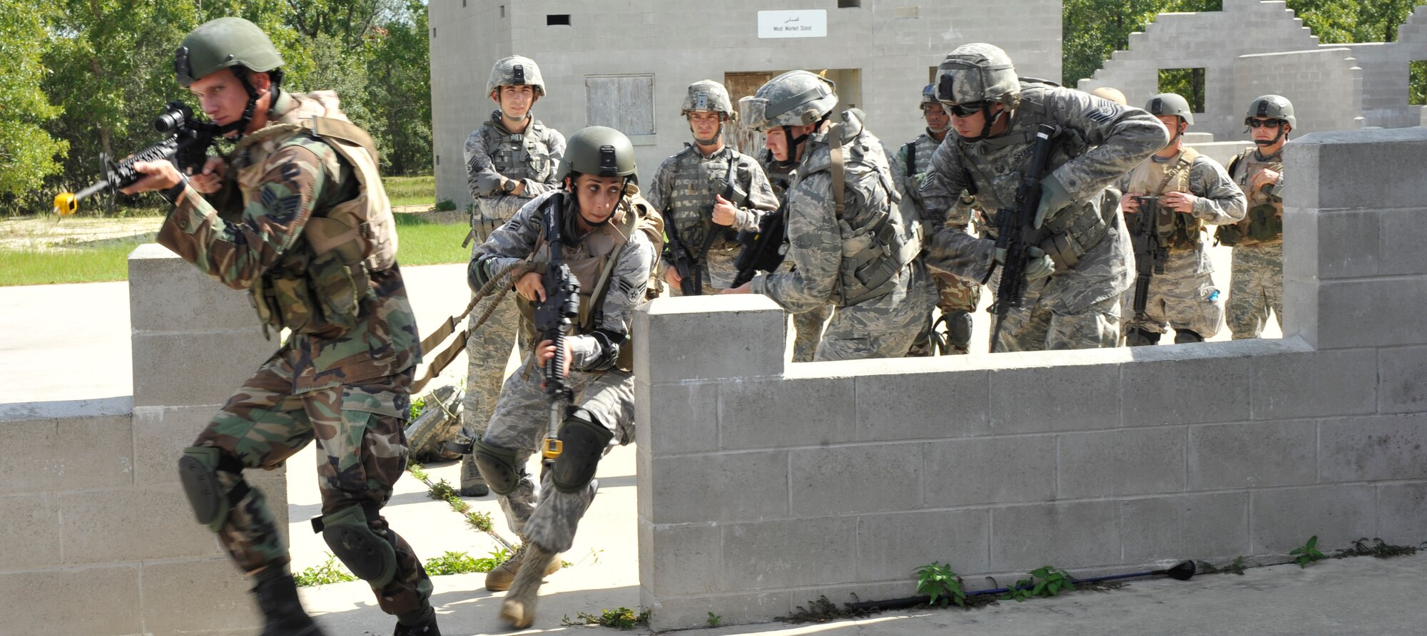CAMP BLANDING, Fla. -- Students in the Cyclogenesis course at Camp Blanding participate in various scenarios during military operations in urban terrain village training here July 29. Among those in the course were members from the 93rd Air Ground Operations Wing, a tenant wing at Moody Air Force Base, Ga. (U.S. Air Force photo by Senior Airman Schelli Jones)