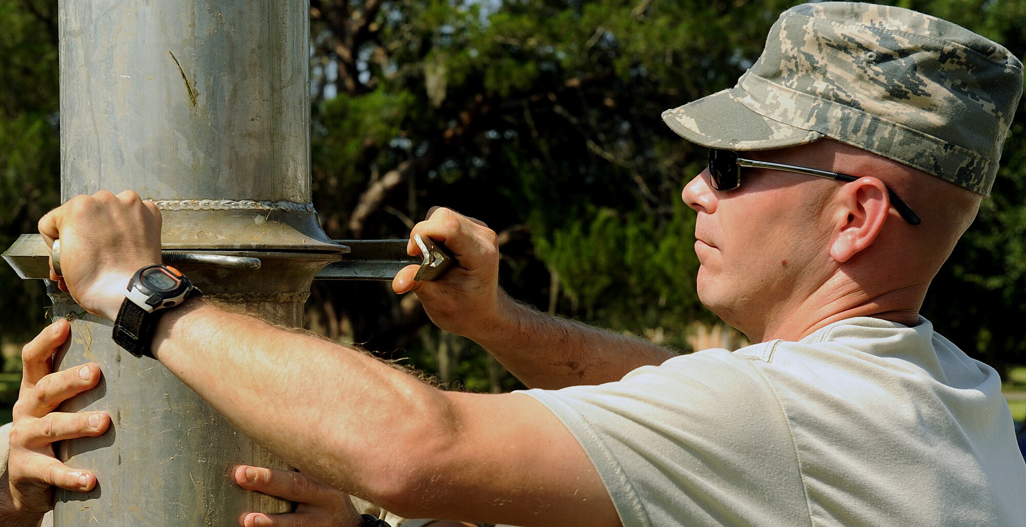 MOODY AIR FORCE BASE, Ga. -- Staff Sgt. Brandon Coffman, 23rd Civil Engineer Squadron fuels maintenance craftsman, connects two pipes with a washer during a repair on a main water line here Aug. 11. (U.S. Air Force photo by Airman 1st Class Joshua Green)