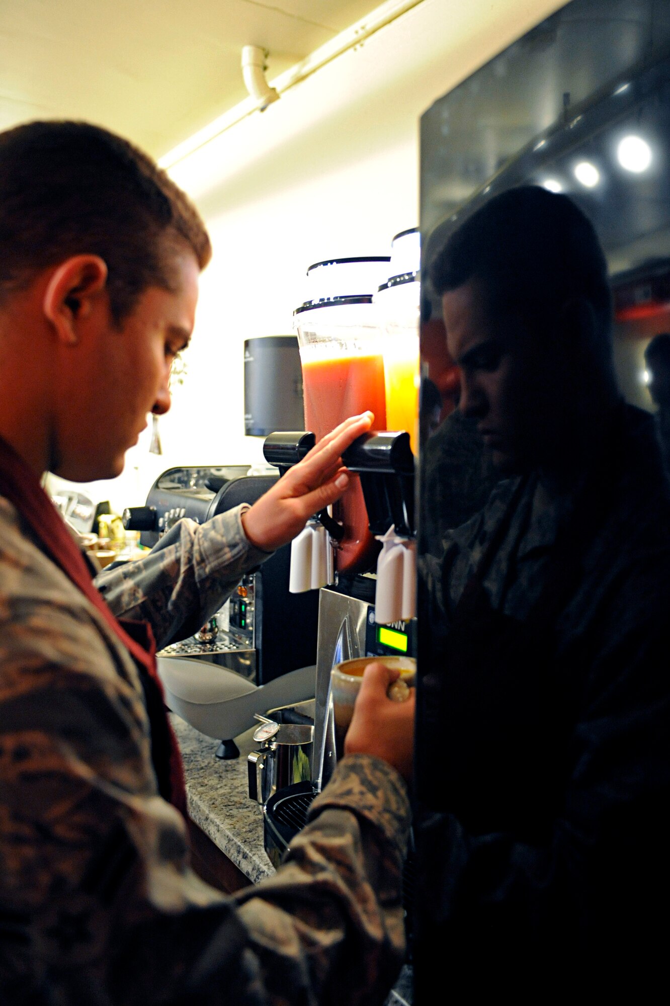 Airman 1st Class Sean Geverts, 28th Logistics Readiness Squadron material management inspector and member of the Airmen Ministry Council, prepares a smoothie at the Airman Ministry Center here, August 11. The AMC hosted an open house for wing leadership to get an idea of what activities will happen in the facility. (U.S. Air Force photo/Airman 1st Class Matthew Flynn)