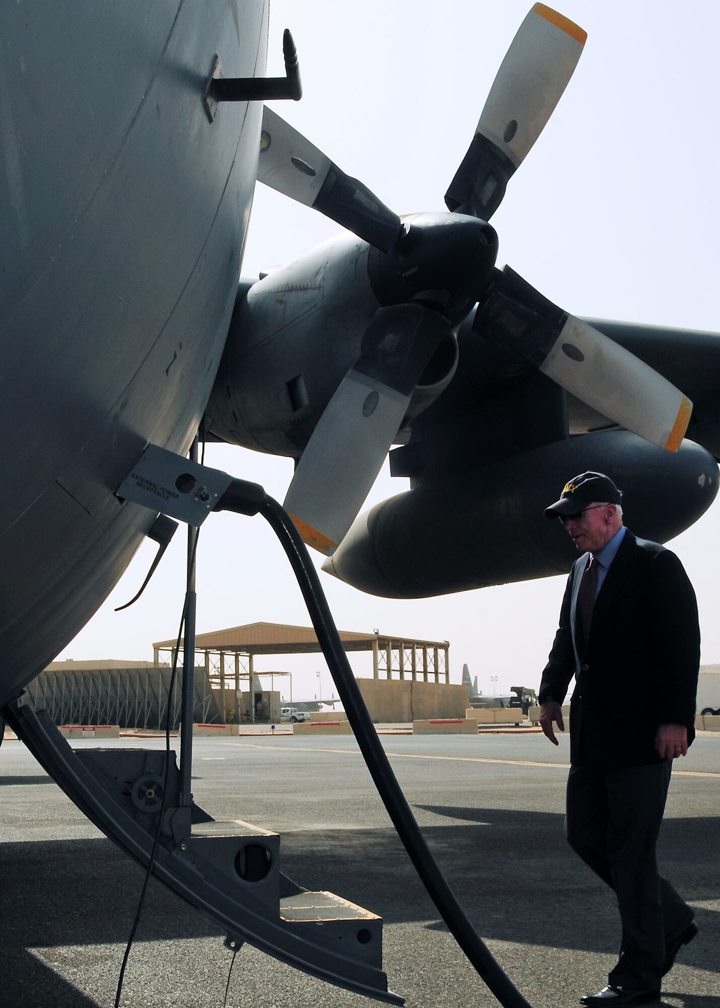 SOUTHWEST ASIA -- Sen. John McCain (R-Ariz.) prepares to board a C-130 Hercules on the 386th Air Expeditionary Wing parking ramp at an undisclosed location in Southwest Asia August 14.  Sen. McCain was at the 386th AEW for a brief stop before departing for other locations in the area of responsibility.  (U.S. Air Force photo/Tech Sgt. Tony Tolley)