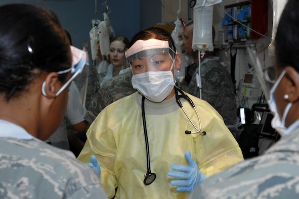 KIRKUK REGIONAL AIR BASE, Iraq – Capt. Melissa Dooley, 506th Expeditionary Medical Squadron, emergency room doctor, prepares a trauma response team to treat a simulated burn victim during a joint mass-casualty exercise here Aug. 7. Capt. Dooley, a Litchfield, Minn., native, is deployed here from 96th Medical Group, Eglin Air Force Base, Fla. (U.S. Air Force photo /Staff Sgt. Joshua Breckon)