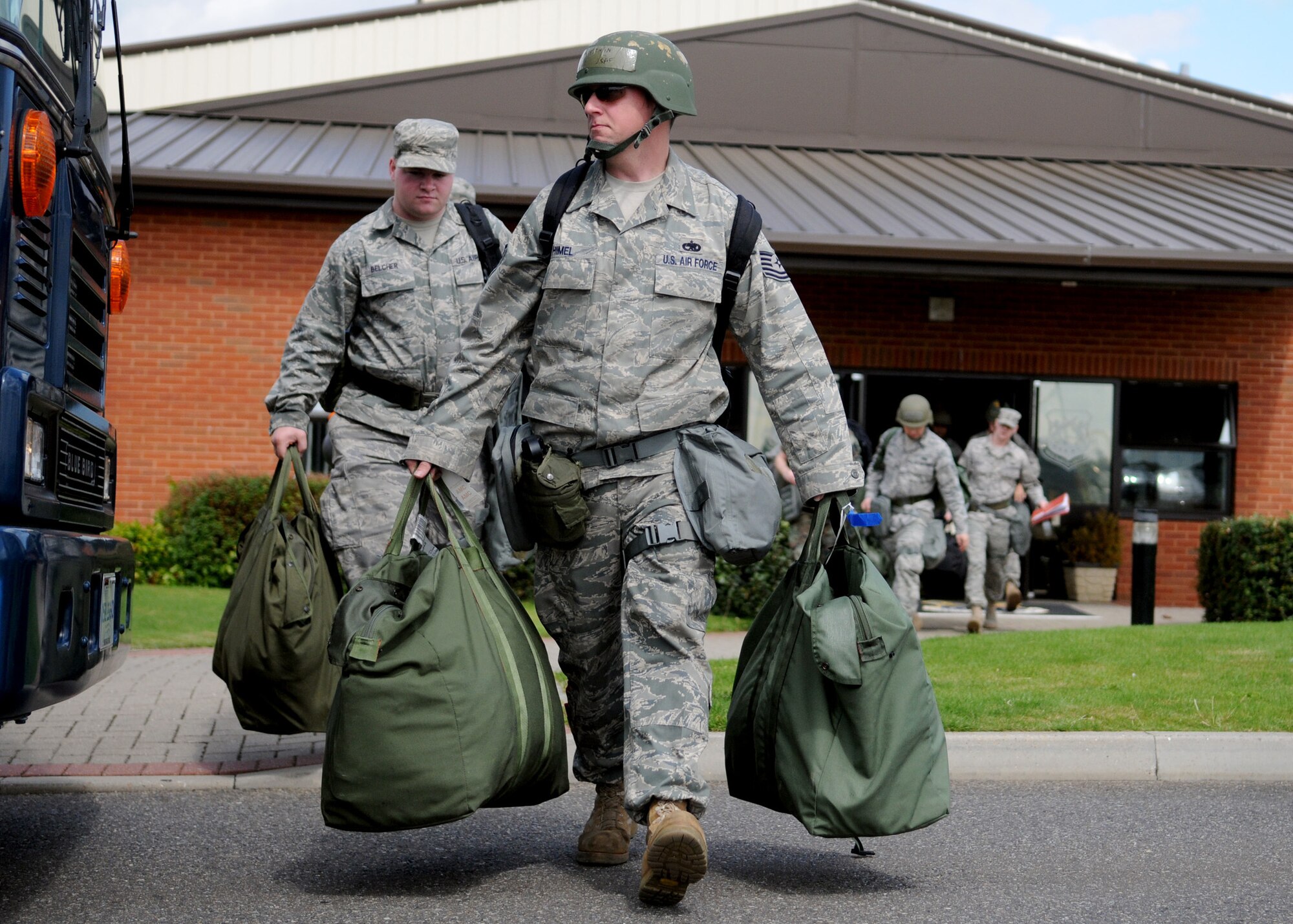 RAF MILDENHALL, England – Tech. Sgt. Jonathan Himel, 100th Maintenance Squadron, prepares to board a bus with all his deployment gear during the Phase I portion of the exercise Aug. 13. Airmen participate in the exercise to practice for the possibilities of a real world deployment. (U.S. Air Force photo by Staff Sgt. Jerry Fleshman)