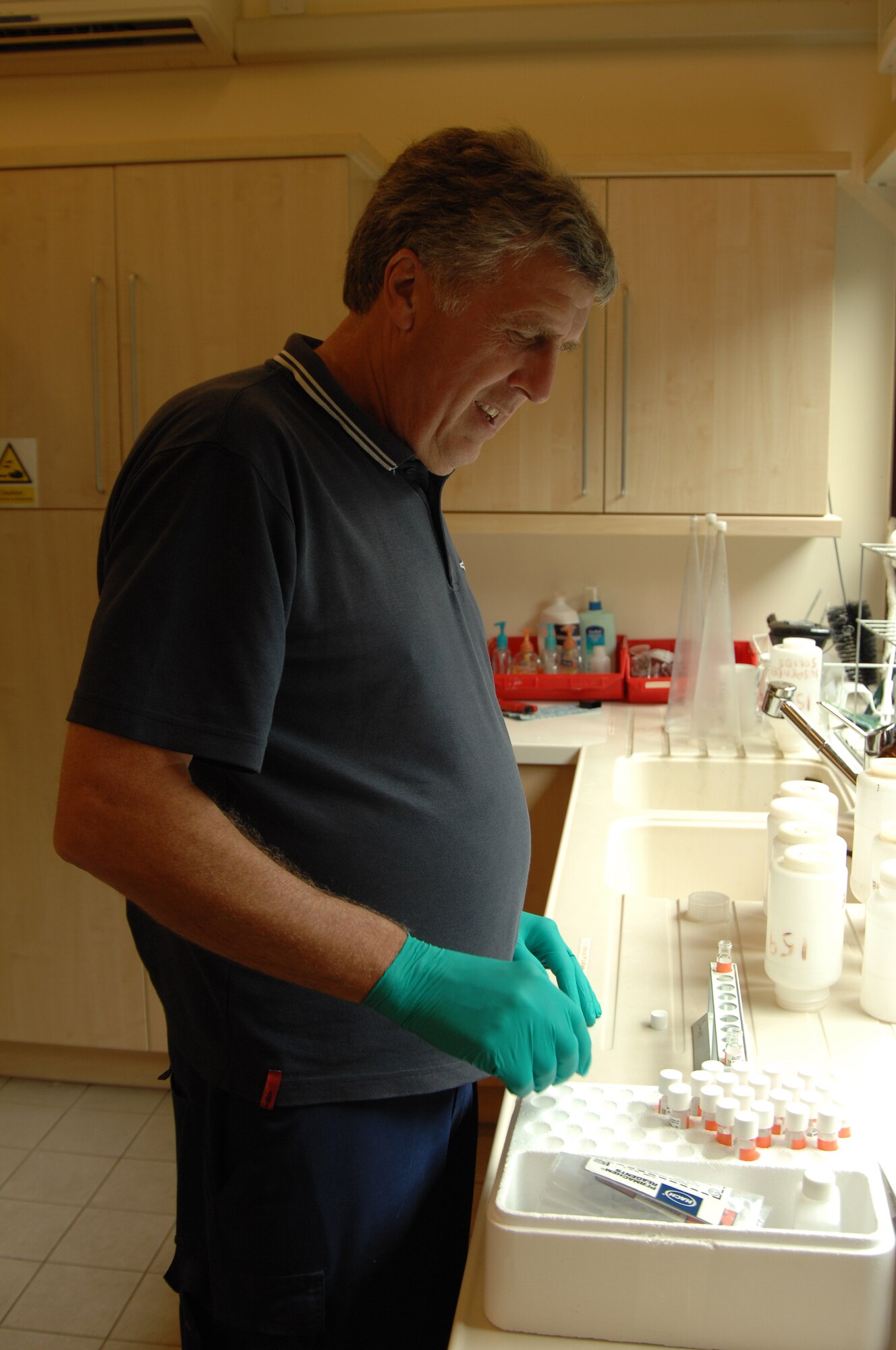 Robert Hodges, 48th Civil Engineer Squadron Waste and Water treatment operator, performs a daily test on the final overflow, August 6, 2009, at RAF Lakenheath, England. The test is done on the filtered water to ensure ammonia levels are safe and the water is in compliance with environmental agency standards. The waste and water plant cleans the water by passing it through several treatment and filtration processes before reintroducing it into the environment. (U.S. Air Force photo/Cassie Coleman)