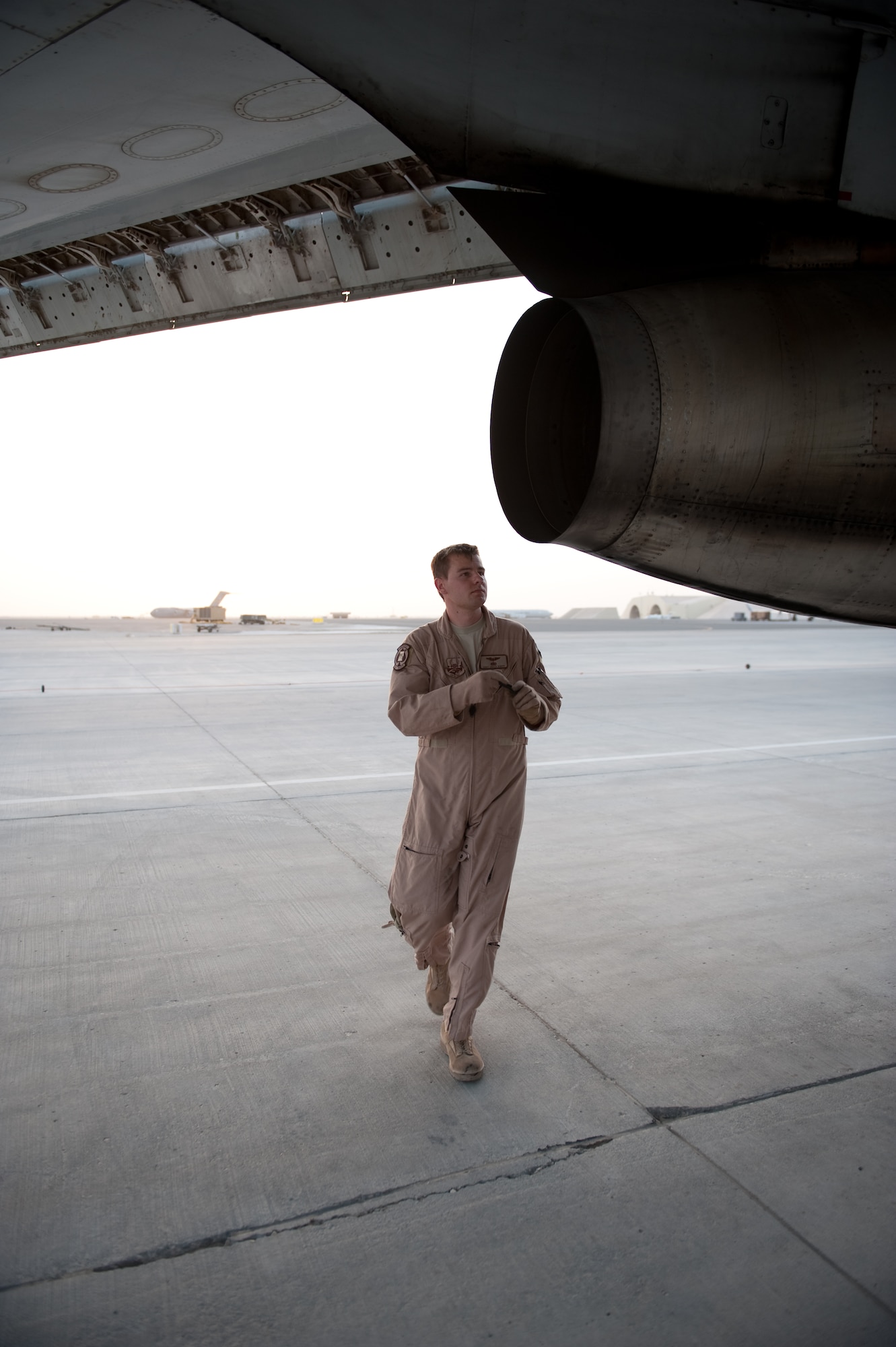 Staff Sgt. Jared Koepp, 7th Expeditionary Air Command and Control Squadron flight engineer, performs a preflight check to ensure an E-8 Joint Surveillance Target Attack Radar System aircraft is safe to fly, Aug. 11, in Southwest Asia. The JSTARS is an airborne battle management, command and control, intelligence, surveillance and reconnaissance platform. Sergeant Koepp is a native of Seguin, Texas, and is deployed from Robins Air Force Base, Ga., in support of Operations Iraqi and Enduring Freedom. (U.S. Air Force Photo/ Staff Sgt. Robert Barney) 