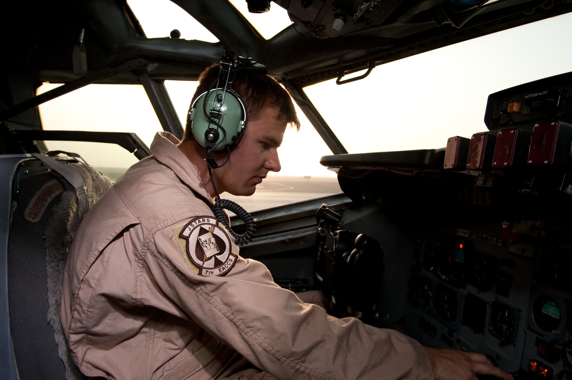 Staff Sgt. Jared Koepp, 7th Expeditionary Air Command and Control Squadron flight engineer, performs a preflight check to ensure an E-8 Joint Surveillance Target Attack Radar System aircraft is safe to fly, Aug. 11, in Southwest Asia. The JSTARS is an airborne battle management, command and control, intelligence, surveillance and reconnaissance platform. Sergeant Koepp is a native of Seguin, Texas, and is deployed from Robins Air Force Base, Ga., in support of Operations Iraqi and Enduring Freedom. (U.S. Air Force Photo/ Staff Sgt. Robert Barney) 