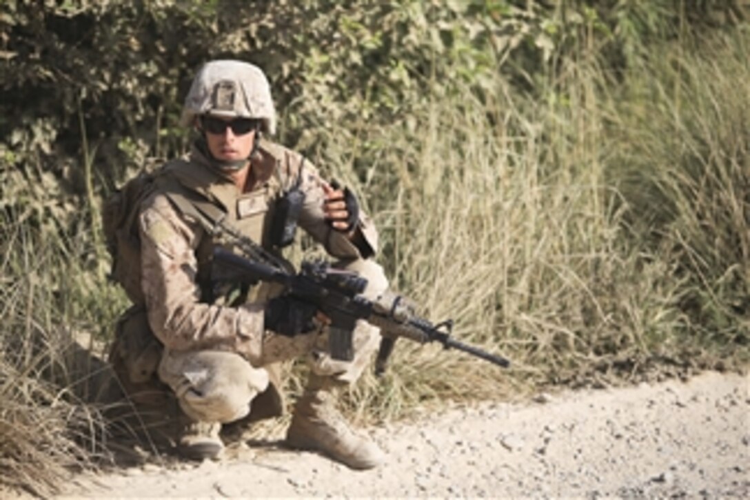 U.S. Marine Corps Cpl. Bartlett, a radio operator with the 1st Battalion, 5th Marine Regiment, provides security during a patrol in the Nawa district of Afghanistan's Helmand province on Aug. 13, 2009.  The 1st Battalion, 5th Marine Regiment is deployed with Regimental Combat Team 3, which conducts counter insurgency operations in partnership with Afghan National Security Forces in southern Afghanistan.  