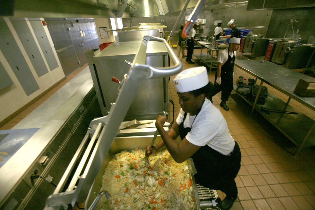 Sgt. Shannon Winslow, a cook at the Marine Corps Air Station Miramar dining facility,  prepares a large batch of lo mein for the specialty bar.