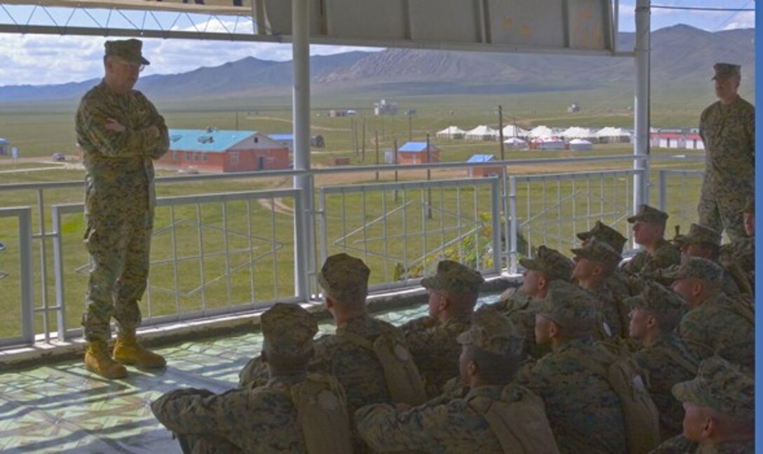 Lt. Gen. Keith J. Stalder, commanding general, MARFORPAC, speaks with Marines from 3rd Assault Amphibian Battalion, 1st Marine Division, Marine Corps Base Camp Pendleton, Calif., Aug. 15 at Five Hills Training Area, Mongolia. Stalder thanked the Marines for their ensuing participation in Khaan Quest 2009 and expressed his gratitude for their efforts in continuing to uphold peacekeeping operations around the world. (Official Marine Corps photo by Cpl. Daniel H. Woodall)