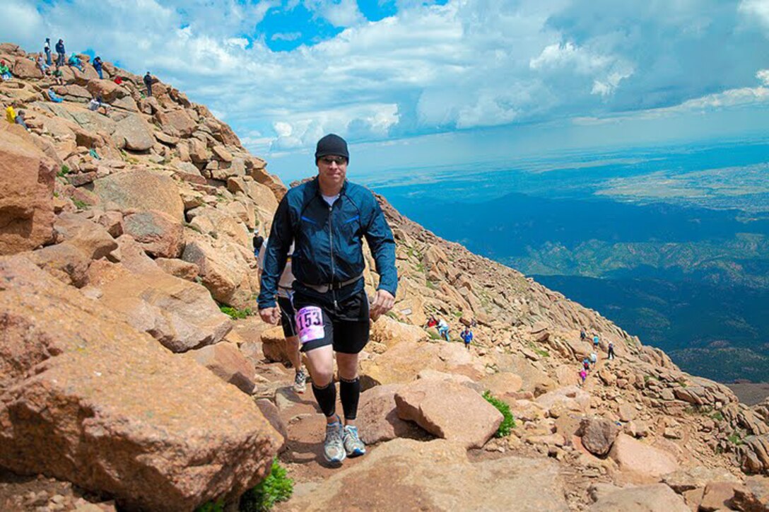 Staff Sgt. James Haunty, an instructor at Marine Corps Communications-Electronics School, makes his way up the 13.3-mile path, which winds its way through Pikes Peak Ascent in Colorado Aug. 15. Haunty was one of six Marines who took part in the half-marathon where they encountered severe weather changes which made the trek much more challenging.