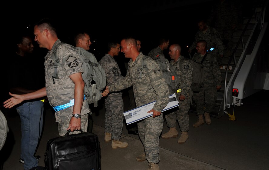 MOODY AIR FORCE BASE, Ga. -- Members from the 23rd Aircraft Maintenance Unit are greeted by family members, friends and wing leadership as they return from a six-month deployment during the early morning hours here Aug. 15. (U.S. Air Force photo by Airman 1st Class Joshua Green)