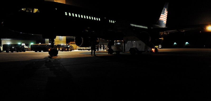 MOODY AIR FORCE BASE, Ga. -- During the early morning hours, a Boeing 757 is seen parked on the flightline, as Airmen from the 23rd Aircraft Maintenance Unit anxiously wait to be reunited family members and friends after returning from a six-month deployment here Aug. 15. (U.S. Air Force photo By Airman 1st Class Joshua Green)