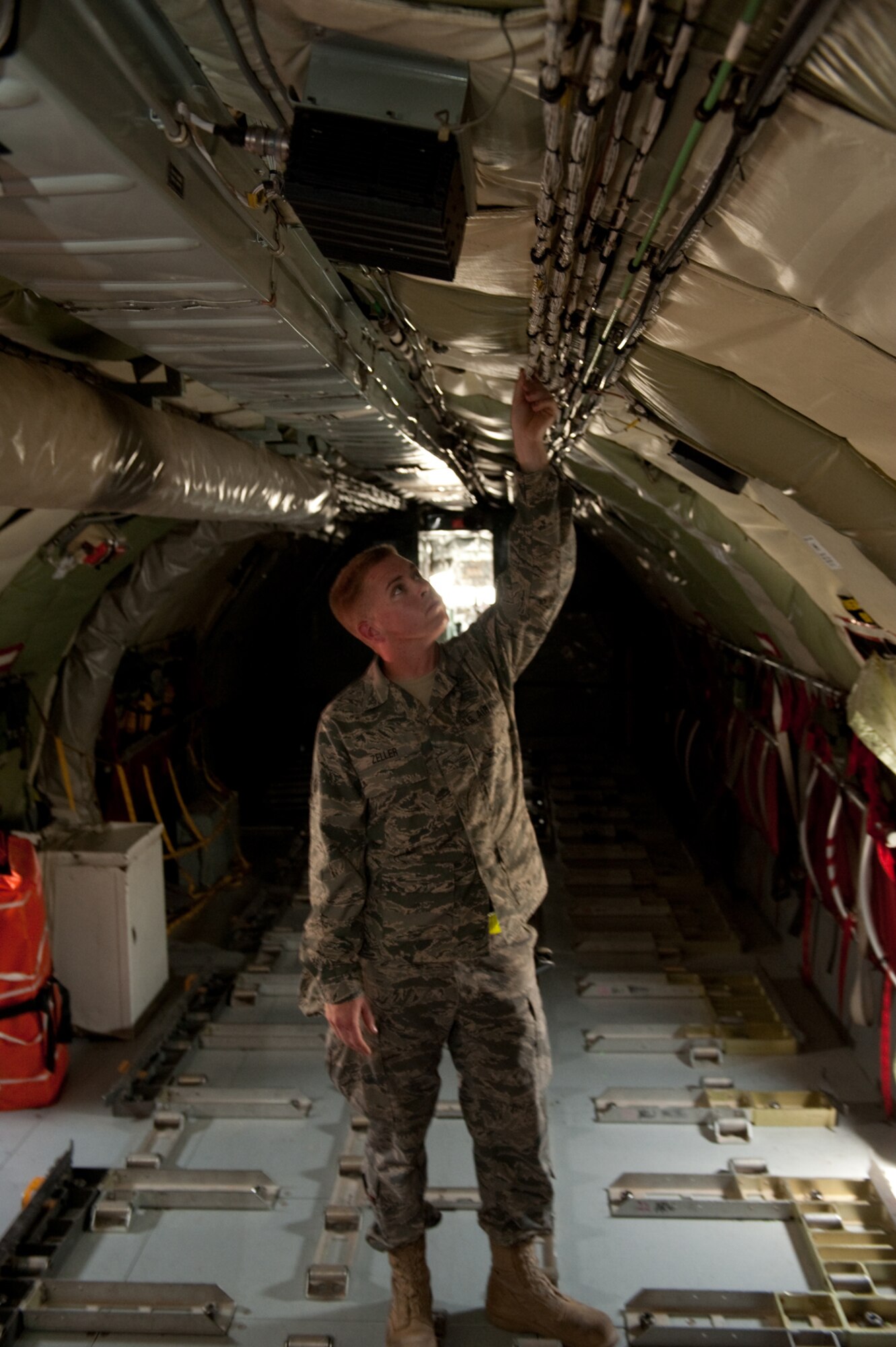 Senior Airman Ryne Zeller, 340th Aircraft Maintenance Unit aircraft electrical environmental systems technician, performs a preflight check to ensure a KC-135 Stratotanker is safe to fly, Aug. 11, in Southwest Asia. The KC-135 provides aerial refueling support to Air Force, Navy and Marine Corps and allied nation aircraft. Airman Zeller is a native of Chandler, Ariz., and is deployed from the Arizona Air National Guard in support of Operations Iraqi and Enduring Freedom. (U.S. Air Force Photo/ Staff Sgt. Robert Barney)