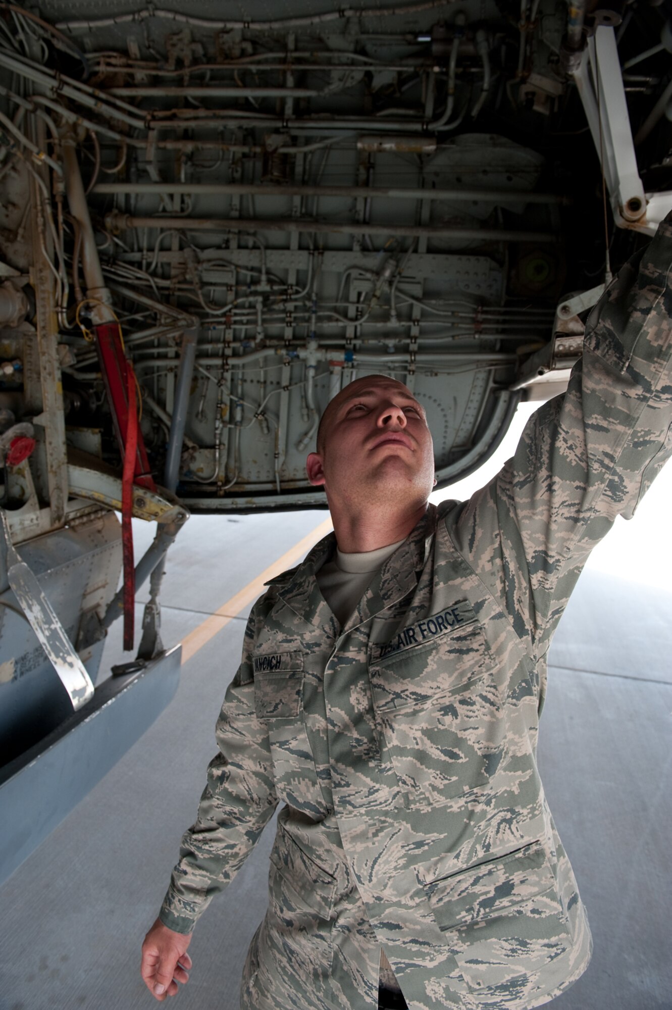 Staff Sgt. Marcus Yancich, 340th Aircraft Maintenance Unit crew chief, performs a preflight check to ensure a KC-135 Stratotanker is safe to fly, Aug. 11, in Southwest Asia. The KC-135 provides aerial refueling support to Air Force, Navy and Marine Corps and allied nation aircraft. Sergeant Yancich is a native of New Orleans and is deployed from MacDill, Air Force Base, Fla., in support of Operations Iraqi and Enduring Freedom. (U.S. Air Force Photo/ Staff Sgt. Robert Barney) 