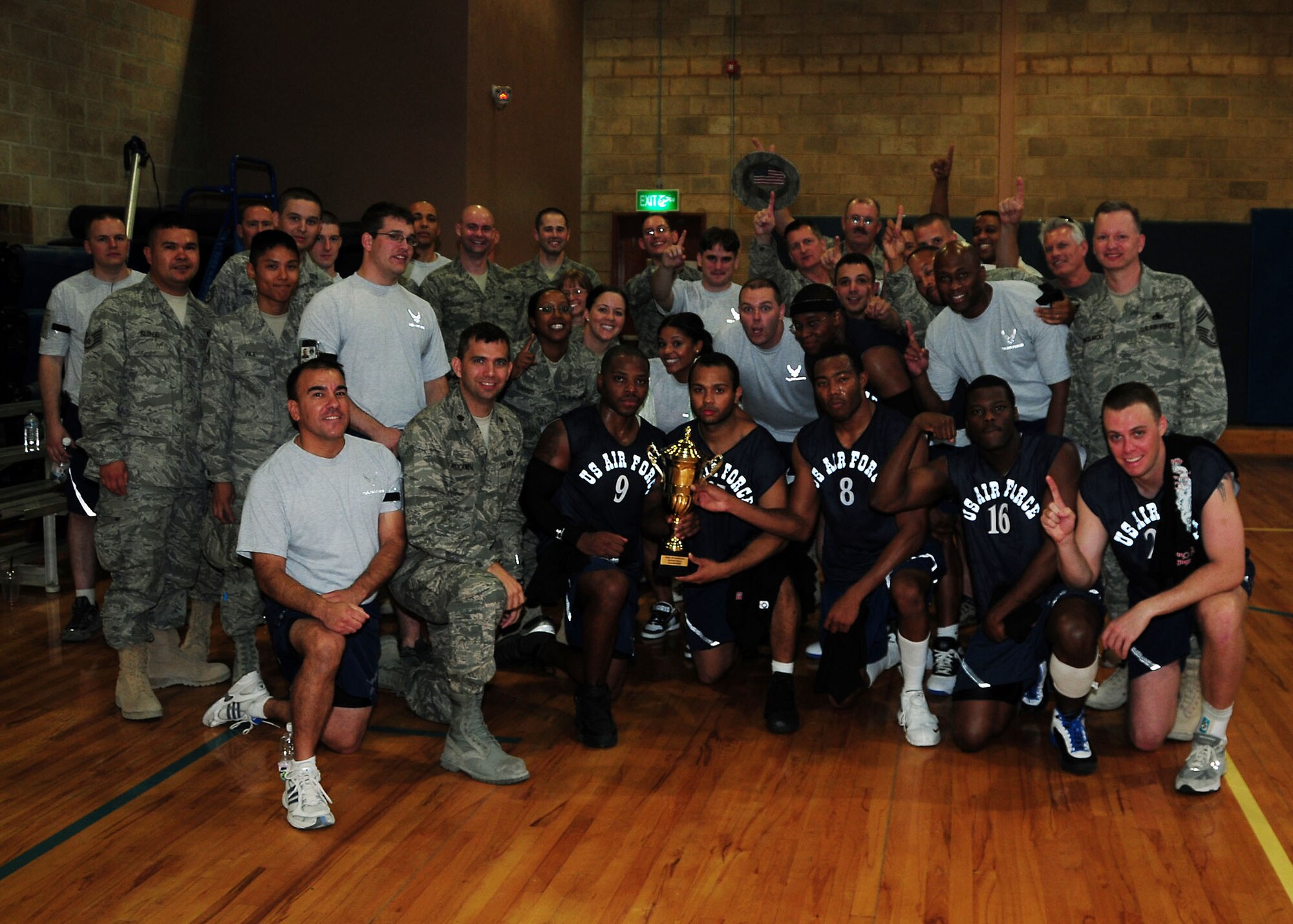 SOUTHWEST ASIA -- 386th Expeditionary Communications Squadron members pose for a group photo with their intramural basketball team after they defeated the 387th Air Expeditionary Group 57-50 to win the wing championship at an undisclosed location in Southwest Asia August 14.  (U.S. Air Force photo/Tech Sgt. Tony Tolley)