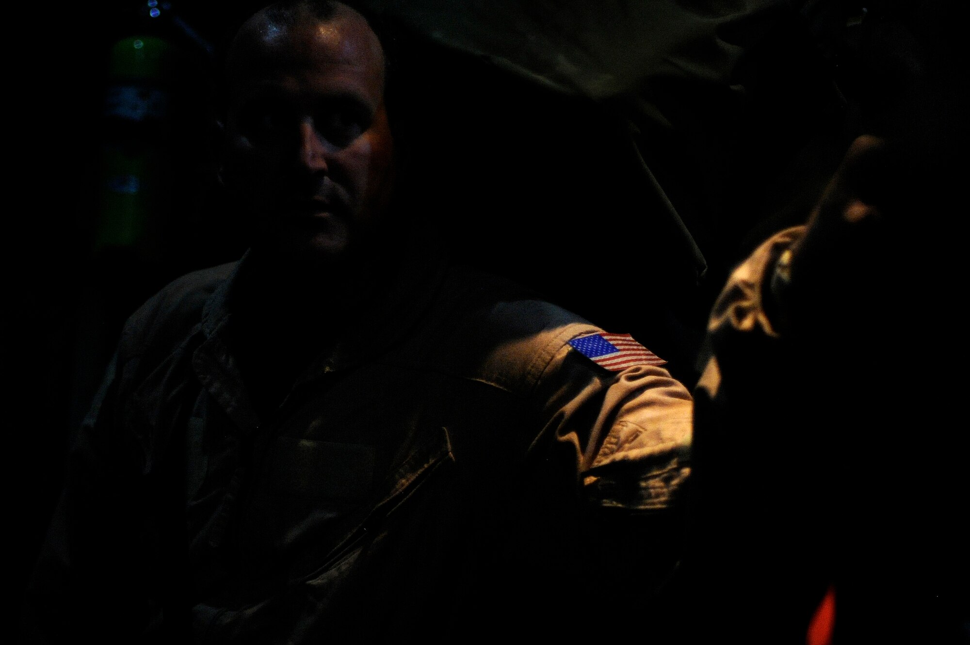 BAGRAM AIRFIELD, Afghanistan - Staff Sgt. Mike Klinkert, a Fly Away Security Team (FAST) member, prepares to exit and secure a C-130H Hercules at Jalalabad Airfield, Afghanistan, Aug. 13, 2009. FASTs are a select few of the 455th Expeditionary Security Forces Squadron from Bagram that are responsible for the security of an aircraft, it's crew, and cargo at unsecured airfields. (U.S. Air Force photo/Staff Sgt. Michael B. Keller)