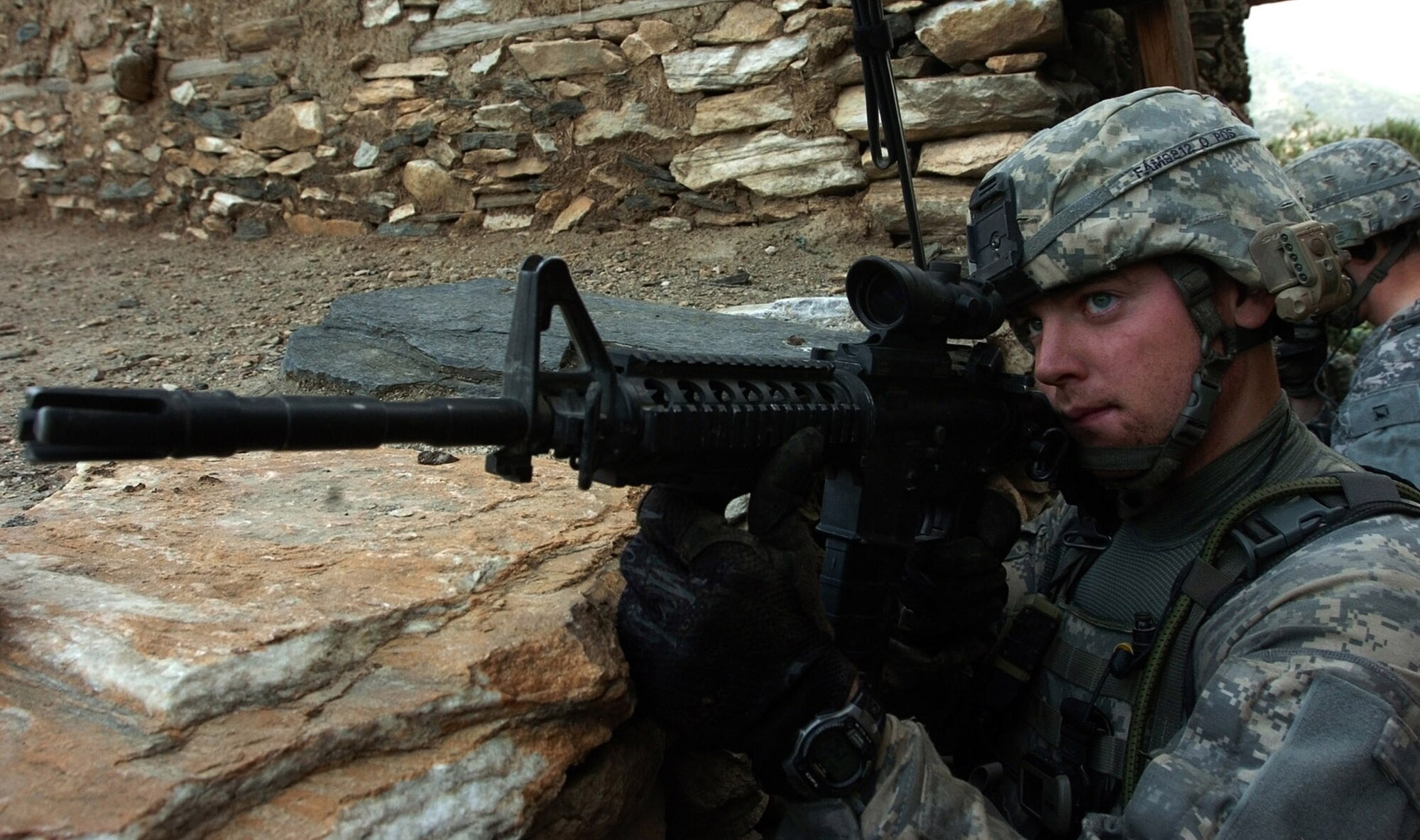 KUNAR PROVINCE, Afghanistan - Senior Airman Gregory Moulton, a native of Lynchburg, Va., fires at insurgent positions during an early morning gun battle in the Korengal valley of Kunar province, Afghanistan, Aug. 13. Moulton is attached to the U.S. Army's Company B, 2nd Battalion, 12th Infantry Regiment, 4th Brigade Combat Team, 4th Infantry Division, based at Fort Carson, Colo. Many Airmen fight side by side with U.S. Army units, serving as liaisons between ground forces and U.S. Air Force bombers and fighter jets patroling Afghan airspace. International Security Assistance Forces across Afghanistan have increased operations in recent months, in order to ensure safety and security during Afghanistan's second national election, scheduled for the end of August. (U.S. Army photo/Sgt. Matthew Moeller)

