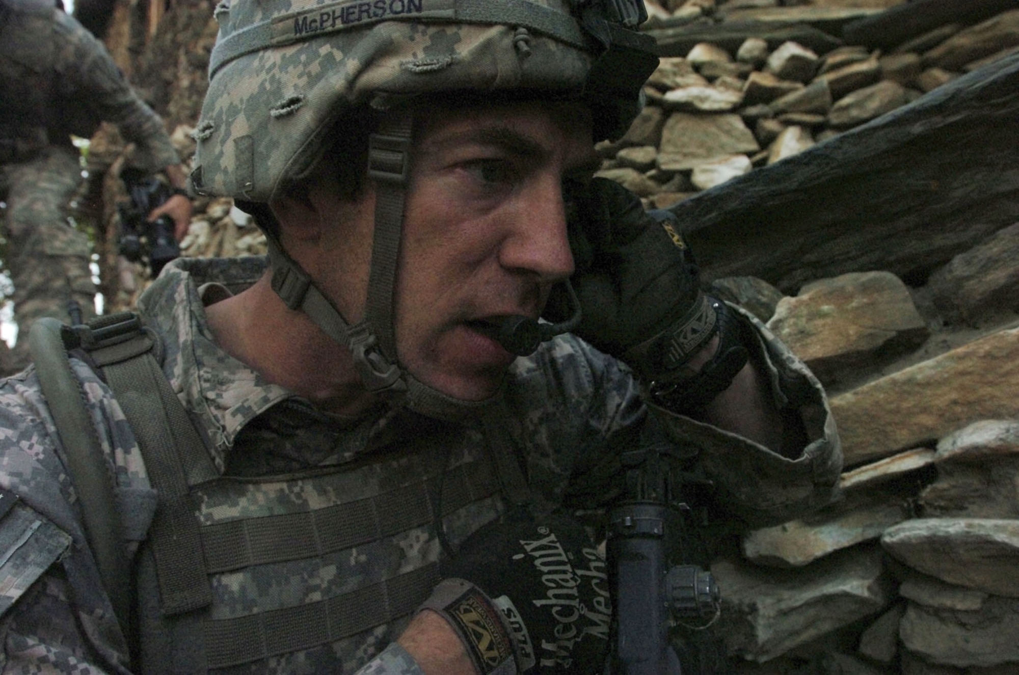 KUNAR PROVINCE, Afghanistan - Tech. Sgt. Joel McPherson, a native of Knoxville, Tenn., calls in an airstrike on insurgent positions in the steep hills of Kunar province, Afghanistan's Korengal valley, Aug. 13. McPherson, a joint terminal attack controller, is attached to Company B, 2nd Battalion, 12th Infantry Regiment, 4th Brigade Combat Team, 4th Infantry Division, based at Fort Carson, Colo. International Security Assistance Forces across Afghanistan have increased operations in recent months, in order to ensure safety and security during Afghanistan's second national election, scheduled for the end of August. (U.S. Army photo/Sgt. Matthew Moeller)
