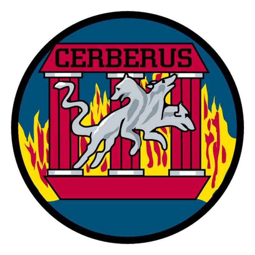 Circular in design, this royal blue patch is edged with a black border. The prominent feature is a lunging, silver, three-headed dog. Behind the dog are three red columns resting on a red pedestal. Across the tops of the columns is a red lintel bearing the word "Cerberus." Silver bands edge the base and the top of each of the three columns. Behind the columns is a yellow fire accented with red.

Cerberus is the gods? three-headed watchdog with the tail of a dragon or a serpent; the three heads symbolize the qualities of loyalty, obedience and fearlessness. The Roman numeral III links the squadron?s number and heritage to one of the greatest professional armies of all time. It also represents the gate that Cerberus guards. Fire, traditionally a symbol of eternity, represents the eternal and undying nature of the ideals of the Third Squadron.

The "Cerberus Three" patch replaced the original Third Squadron patch in 1977. 
