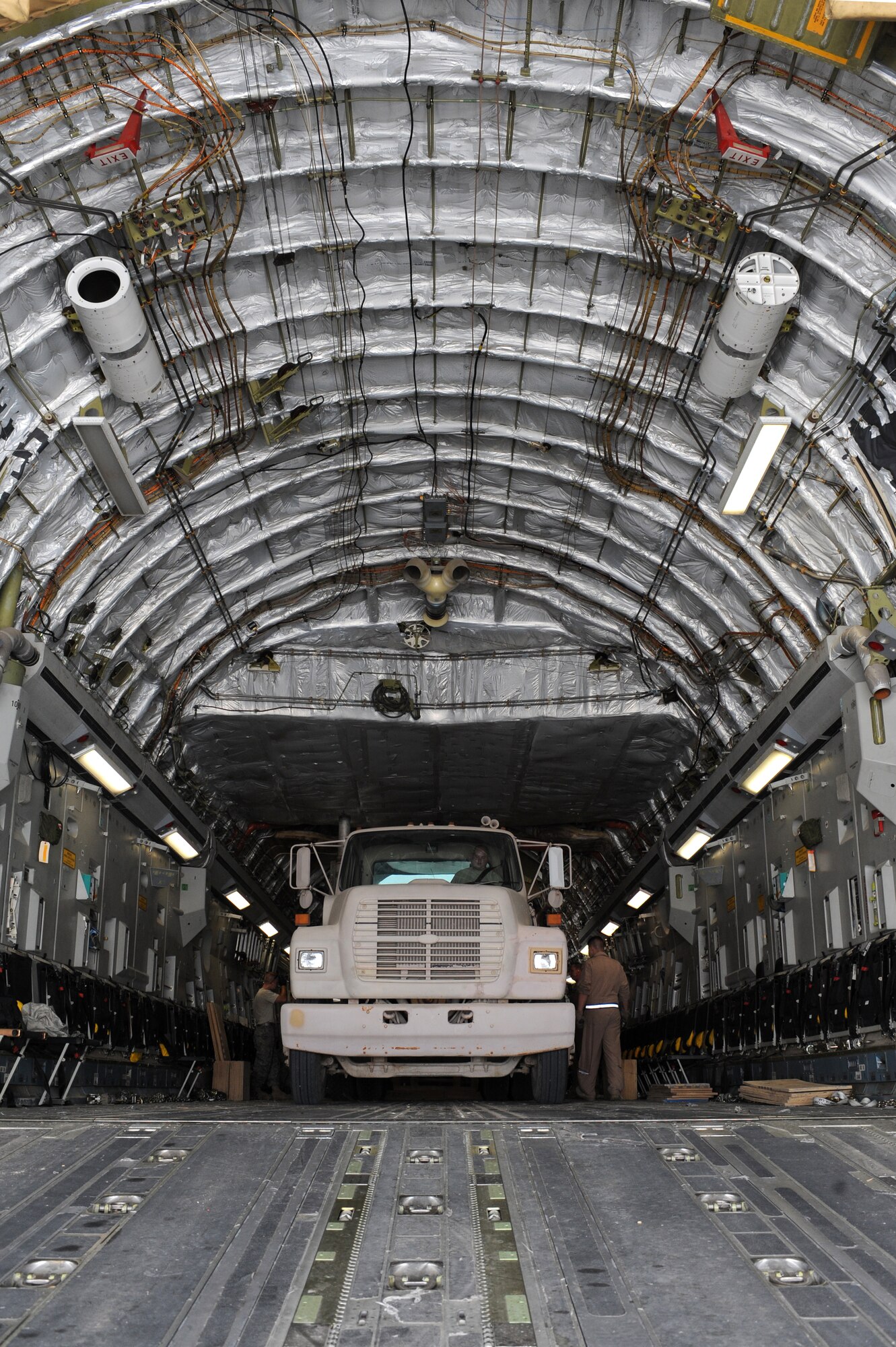 SOUTHWEST ASIA -Staff Sergeant Derrick Chandler, 380th Expeditionary Logistics Readiness Squadron, Air Terminal Operations Center, prepares to drive a cargo trailer off of a C-17 aircraft Aug 14. Sergeant Chandler is from Andrews AFB, Md., and hails from West Virginia. (U.S. Air Force photo/Tech. Sgt. Charles Larkin Sr)
