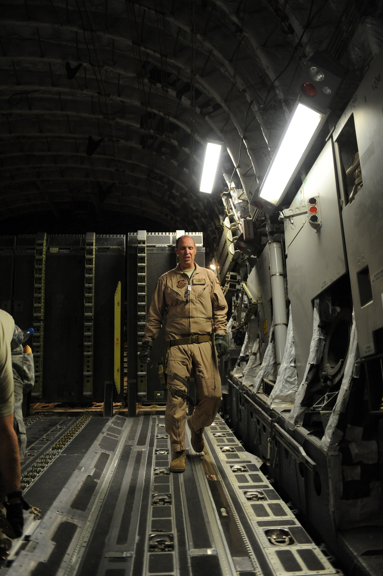 SOUTHWEST ASIA -Master Sgt. Karl Eckburg, C-17 Loadmaster, prepares to open the cargo doors for download of a C-17 aircraft Aug 14. Sergeant Eckburg is from Dover AFB, Del., and hails from Jamestown, N.Y. (U.S. Air Force photo/Tech. Sgt. Charles Larkin Sr)