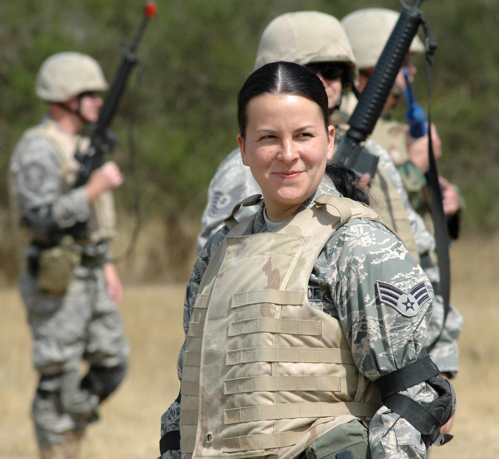 Senior Airman Shannon Wasch, 446th Civil Engineer Squadron, McChord Air Force Base, Wash., is all smiles during a break at combat skills training in preparation for the squadron's air expeditionary force deployment to Iraq at the end of this month. Airman Wasch is one of about 40 Reservists from the squadron who volunteered for the deployment. (U.S. Air Force photo/Tech. Sgt. Jake Chappelle)