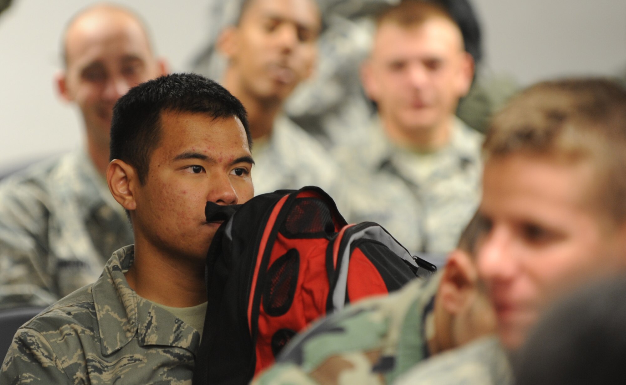 MOUNTAIN HOME AIR FORCE BASE, Idaho -- Airman 1st Class Joel Evangelista, 366th Equipment Maintenance Squadron weapons load crew, waits for deployment briefings Aug. 17. More than 300 members of the 366th Fighter Wing – including aircraft maintainers and aircrews from the 389th Fighter Squadron- will deploy for approximately five months as part of a scheduled rotational deployment to Kunsan Air Base, Republic of Korea. (U.S. Air Force photo by Airman 1st Class Renishia Richardson)
