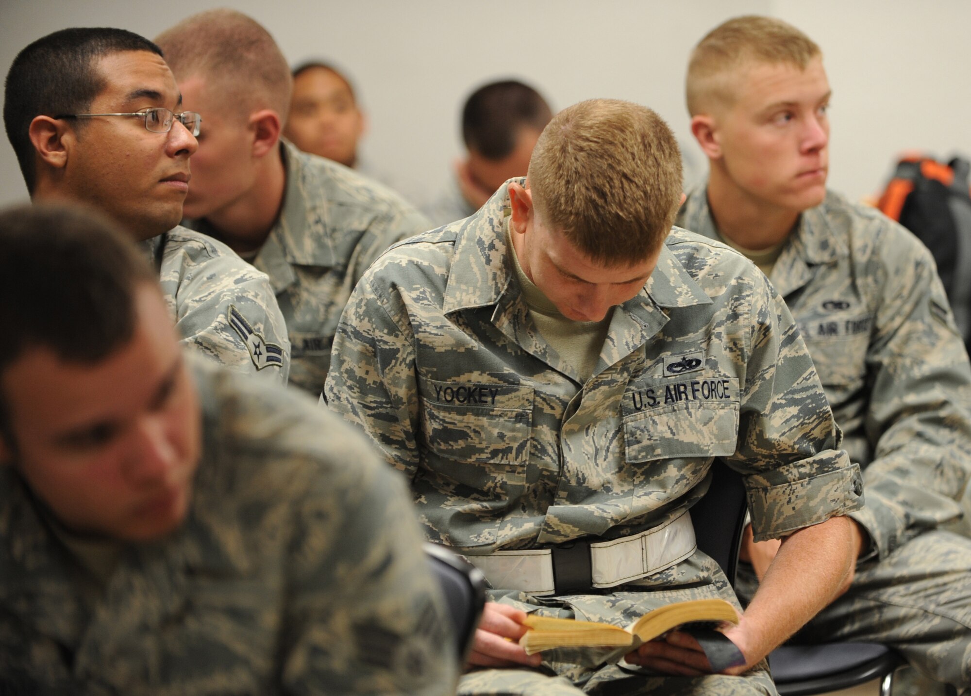 MOUNTAIN HOME AIR FORCE BASE, Idaho – Master Sgt. David Yockey, 366th Equipment Maintenance Squadron age mobility, reads a book while waiting for deployment briefings Aug. 17. More than 300 members of the 366th Fighter Wing – including aircraft maintainers and aircrews from the 389th Fighter Squadron- will deploy for approximately five months as part of a scheduled rotational deployment to Kunsan Air Base, Republic of Korea. (U.S. Air Force photo by Airman 1st Class Renishia Richardson)