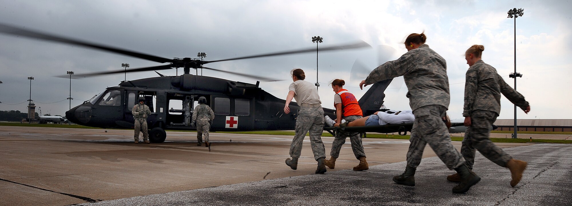 OFFUTT AIR FORCE BASE, Neb.- Airman with the 55th Medical Group work in conjuntion with Soldiers from the Lincoln National Guard to load volunteers posing as severly injured civilians into an awaiting UH-60 Blackhawk helicoptor as part of a joint Major Accident Response Exercise Aug. 15.  Airmen with the 55th Medical Group along with medical professionals from the surrounding Omaha metro area take part in the MARE held annually prior to the "Defenders of Freedom" Open House and Air Show hosted here. U.S. Air Force photo by Josh Plueger