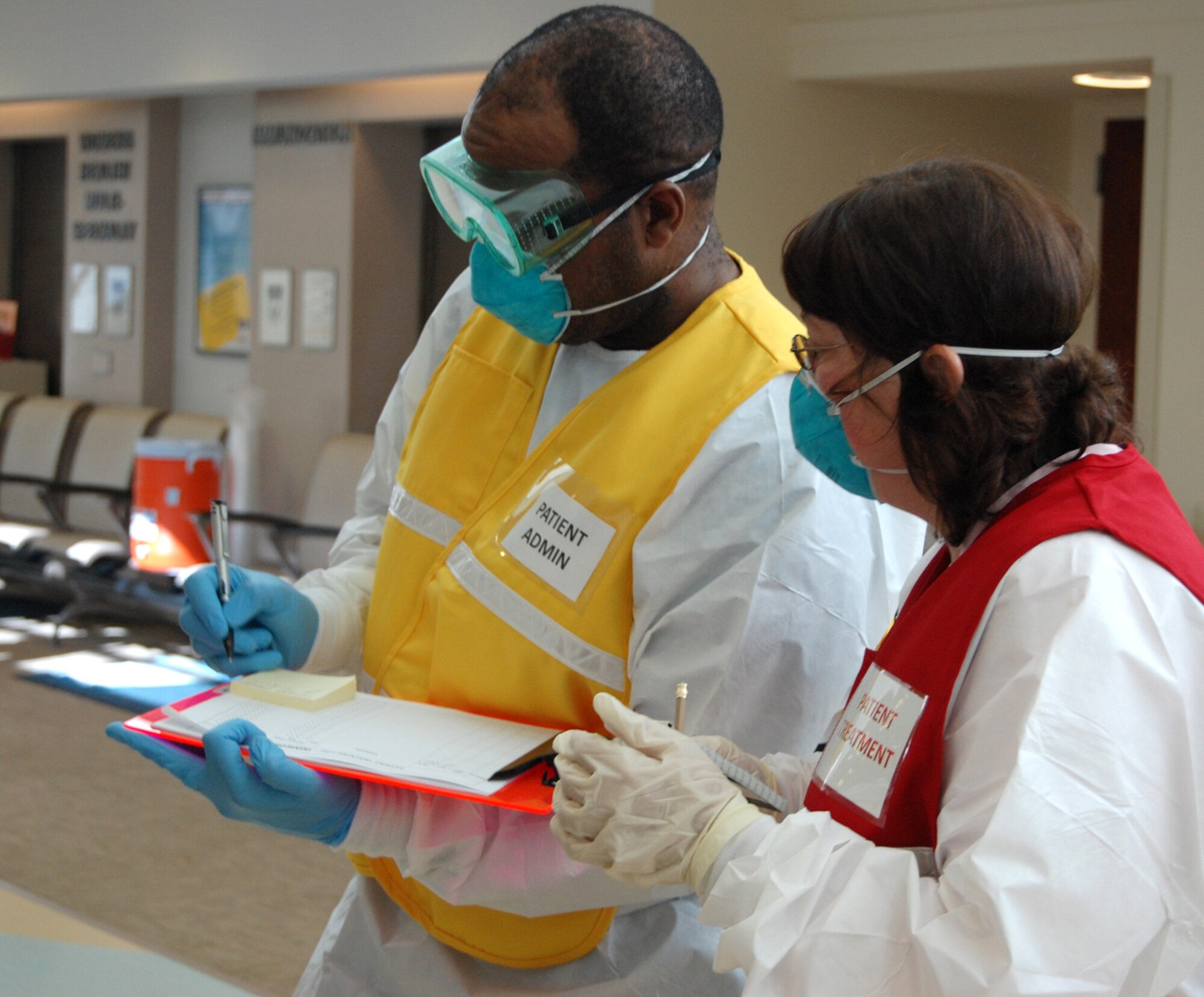 Tech. Sgt. Gregorio Wilkinson, 341st Medical Operations Squadron pediatric medical records technician, and Linda Wallis, 341 MDOS commander’s secretary, track the status of patients during a mass casualty exercise at Malmstrom July 17. The exercise was a culmination of last week’s Medical Emergency Response Capability Assessment and Training. The MERCAT evaluated Malmstrom medics on how well they provide care for more than 100 volunteers with simulated injuries requiring immediate care. (U.S. Air Force photo/Staff Sgt. Marcus McDonald)  )