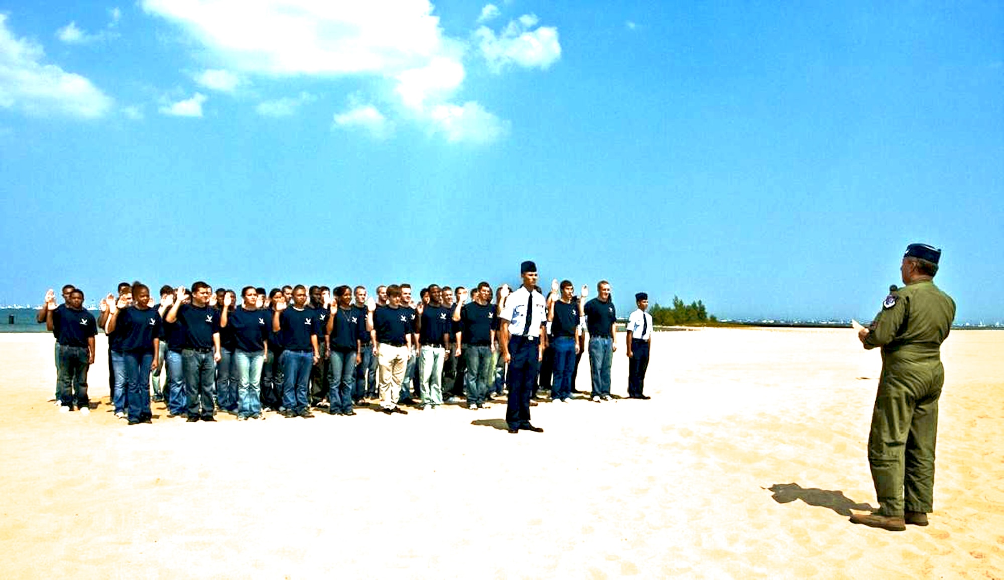 Recruits from the Chicago area take the oath of enlistment in front of thousands of spectators Aug. 15 during the 51st Chicago Air and Water Show.  It is the nation's largest free air show and an estimated 2.2 million people attend.  Maj. Gen. Gregory Feest, commander of Air Education and Training Command's 19th Air Force at Randolph Air Force Base, Texas, conducted the oath of enlistment ceremony.  General Feest is responsible for all Air Force pilot training.  (U.S Air Force photo/AFROTC Cadet Raleigh Randolph) 