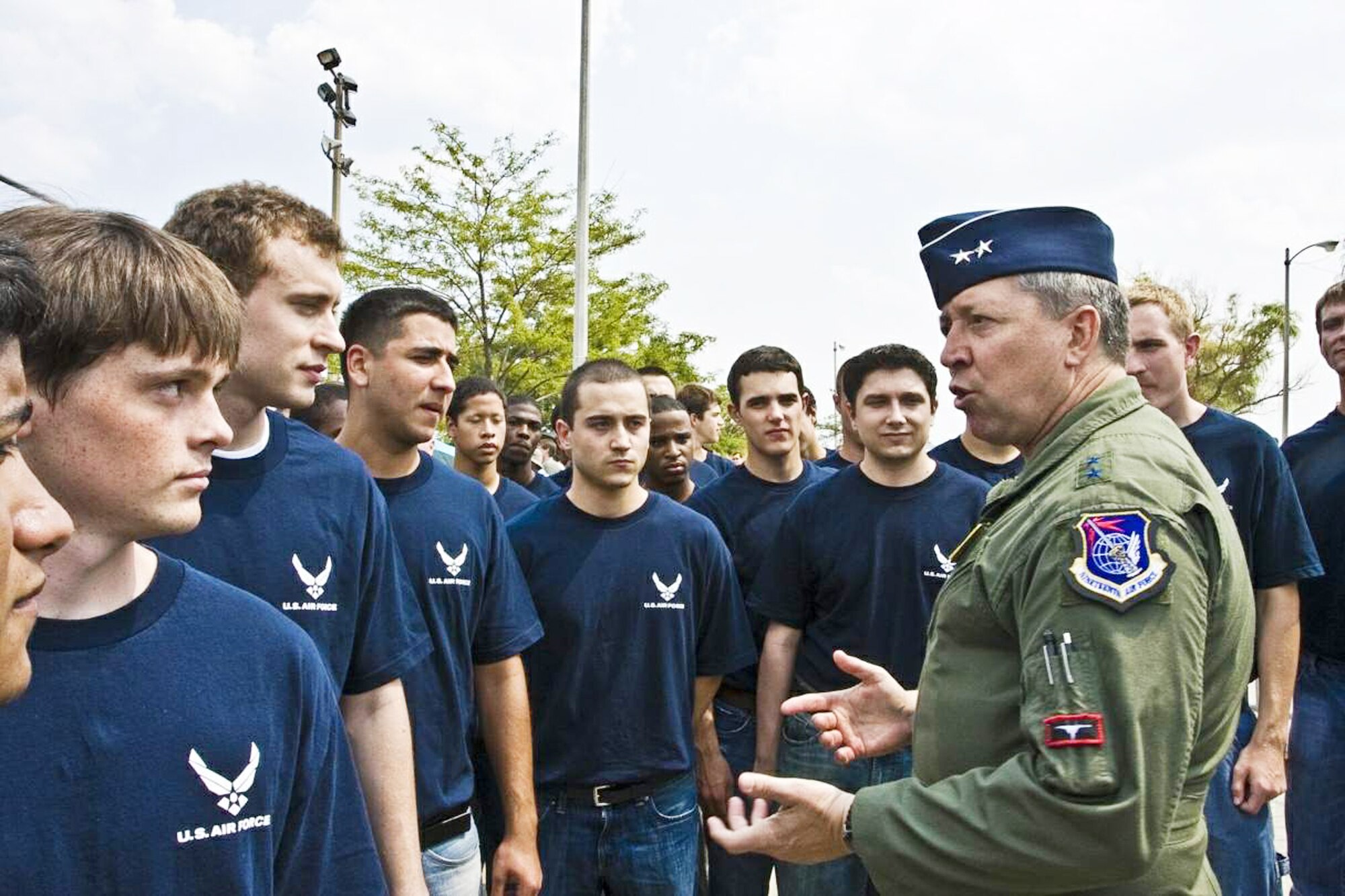 Recruits from the Chicago area listen as Maj. Gen. Gregory Feest, commander of Air Education and Training Command's 19th Air Force at Randolph Air Force Base, Texas, gives tips on achieving success in the Air Force.  Following the chat, General Feest conducted the oath of enlistment ceremony with the recruits on the Chicago lakefront Aug 15 in front of thousands of spectators attending the 51st Chicago Air and Water Show.  (U.S Air Force photo/AFROTC Cadet Raleigh Randolph)