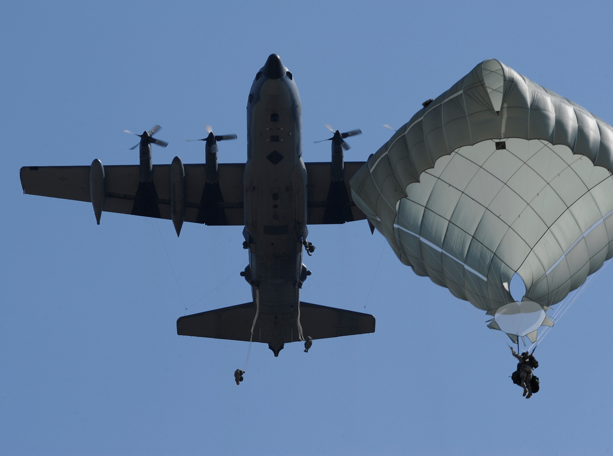 FORT BENNING, GA. ? Army Rangers parachute from a U.S. Air Force MC-130 Combat Talon II assigned to the 15th Special Operation Squadron from Hurlburt Field, Fla., during Ranger Rendezvous 2009 over Ft. Benning, Ga. More than 1,000 Rangers assigned to four Ranger battalions from across the country participated in a mass tactical jump flown by U.S. Air Force aircraft. (U.S. Air Force photo/Senior Airman Jason Epley)