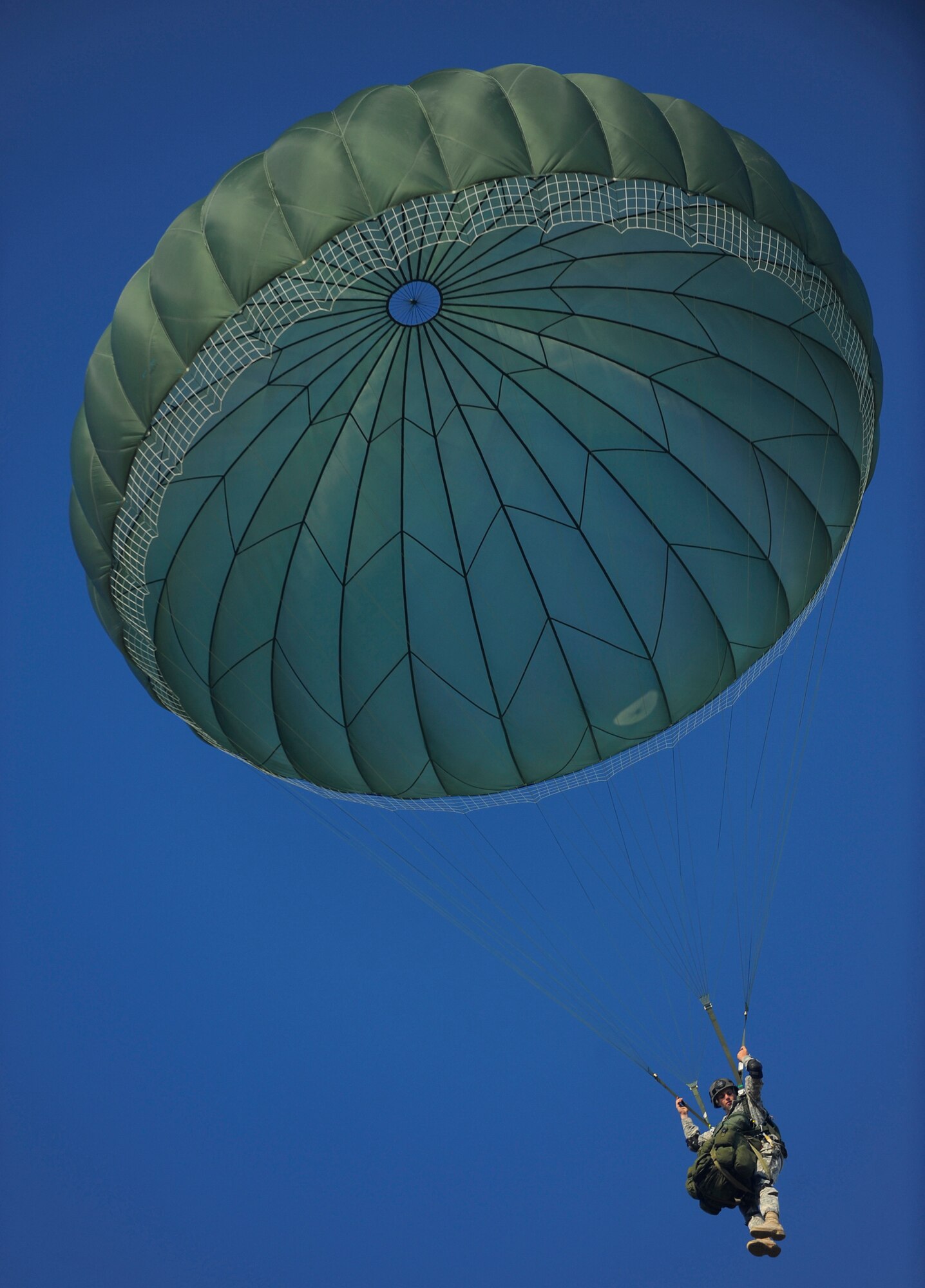 FORT BENNING, GA. ? An Army Ranger descends by parachute during Ranger Rendezvous 2009 over Ft. Benning, Ga. More than 1,000 Rangers assigned to four Ranger battalions from across the country participated in a mass tactical jump flown by U.S. Air Force aircraft. (U.S. Air Force photo/Senior Airman Jason Epley)