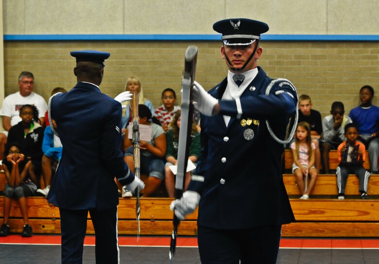 Staff Sgt. Kelly Webster, United States Air Force Honor Guard Drill Team, marches out of the line formation during a16-man routine at the Eglin Air Force Base, Fl., Youth Center Aug. 17. The drill team is the traveling component of the U.S. Air Force Honor Guard and tours worldwide representing all Airmen while showcasing Air Force precision and professionalism. (U.S. Air Force photo by Senior Airman Alexandre Montes)