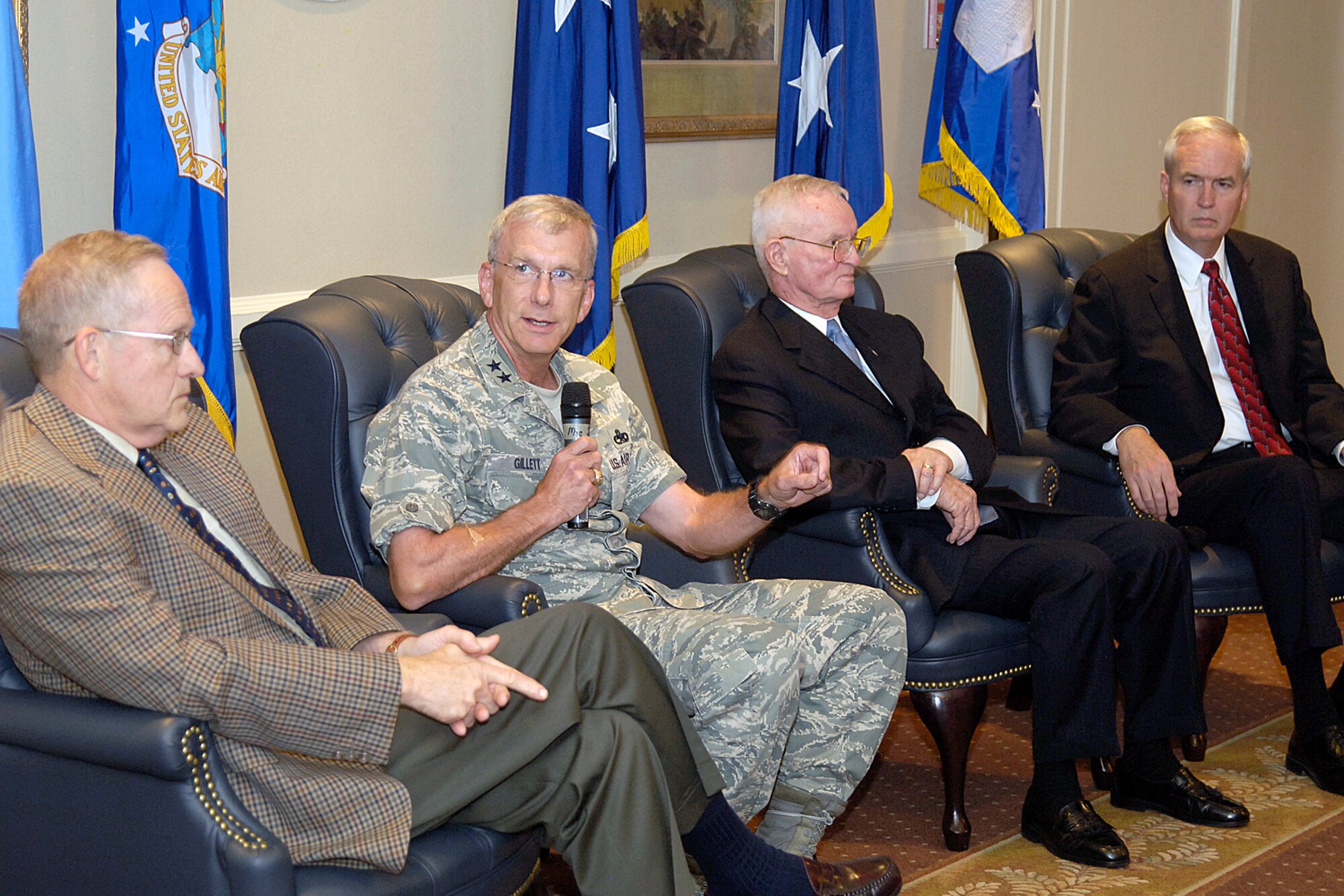 Past and present Air Force logistics leaders answer questions from the audience during a recent panel discussion following a Logistics Officer Association luncheon at Tinker Air Force Base, Okla.  From left are retired Lt. Gen. William Hallin, commander of the Warner Robins Air Logistics Center at Robins Air Force Base, Ga., from 1992 to 1995; Maj. Gen. David Gillett, current Oklahoma City Air Logistics Center commander; retired Maj. Gen. William Bowden, OC-ALC commander from 1985 to 1989; and Robert Conner, director of the OC-ALC from 2005 to 2007. (Air Force photo/Margo Wright)