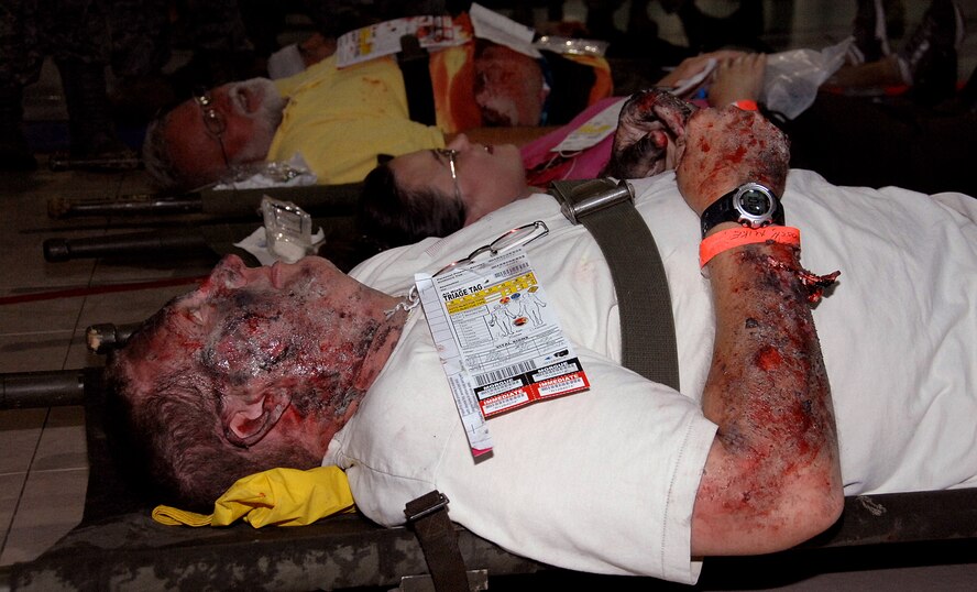 OFFUTT AIR FORCE BASE, Neb.- Offutt and local area volunteers with simulated injuries wait for emergency medical treatment during the Major Accident Response Exercise Aug. 15 at the Offutt Field House. The victims were later transported by emergency vehicles to nine local hospitals for further treatment. U.S. Air Force photo by Kendra Williams.