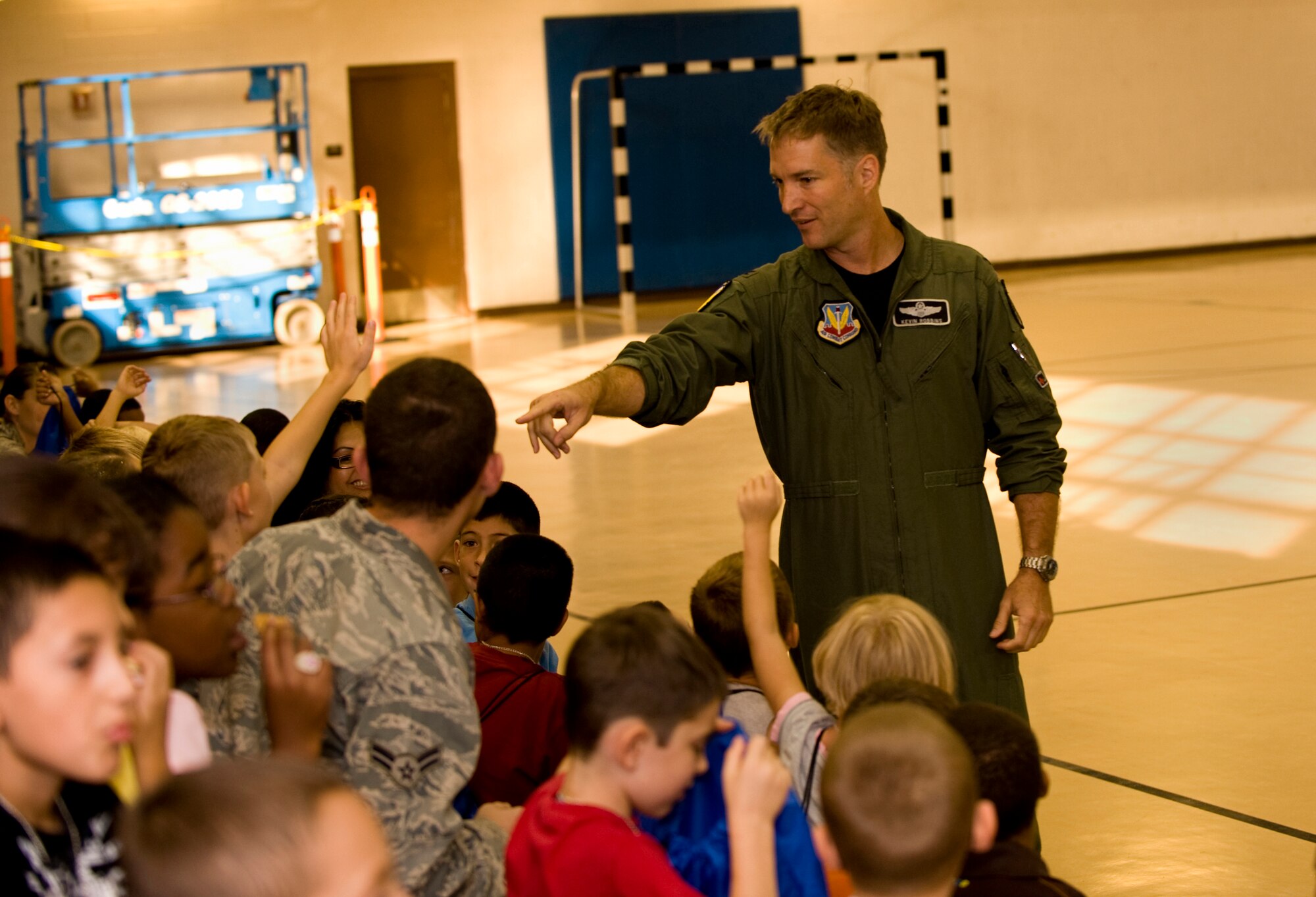 HOLLOMAN AIR FORCE BASE, N.M. -- Col. Kevin Robbins, 49th Fighter Wing vice commander, answers children's questions during Operation K.I.D., a mock deployment for Holloman children, Aug. 14. The event was sponsored by the Airman and Family Readiness Center here. (U.S. Air Force photo Tech. Sgt. Alan Port)