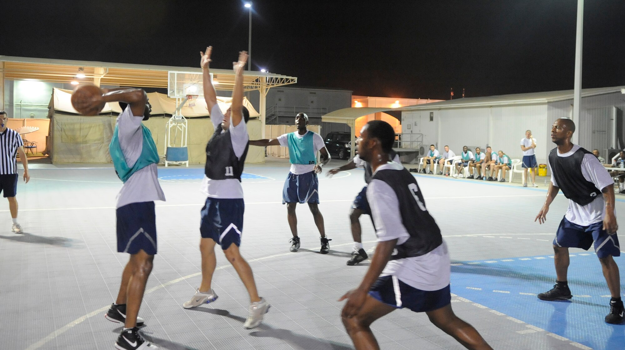 SOUTHWEST ASIA – Senior Airman Semorian Ford, 380th Expeditionary Civil Engineer Squadron, 380th ECES Basketball Team, looks to pass to an open teammate during the 380th Air Expeditionary Wing Basketball Championship Aug. 15. The championship game was between the 380th ECES and the 99th Expeditionary Reconnaissance Squadron basketball teams. The 380th ECES team won 41 to 39. Airman Ford is deployed from Scott AFB, Ill., and hails from Tyler Texas. (U.S. Air Force photo/Senior Airman Stephen Linch)