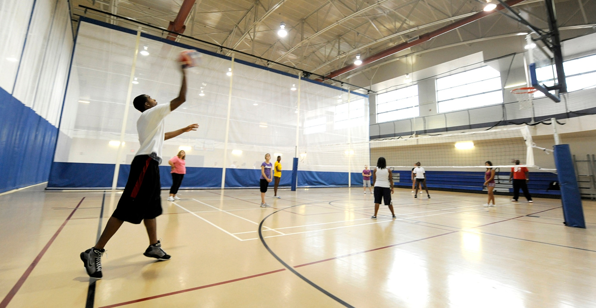 HOLLOMAN AIR FORCE BASE, N.M. -- Teens play volleyball during a two-week Teen Health and Wellness Camp here Aug. 13. Pre-teens and teens learned about living a healthy lifestyle that involves proper nutrition and exercise through classes and hands-on demonstrations. (U.S. Air Force photo by Senior Airman Tiffany Trojca)
