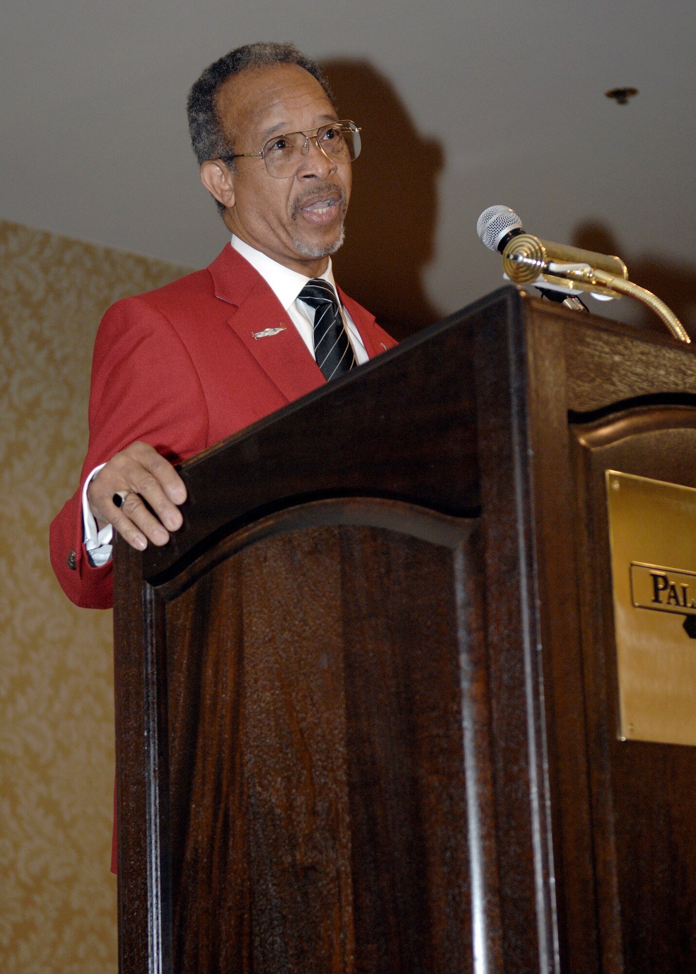Retired Lt. Gen. Russell C. Davis addresses military members and civilians during the Lonely Eagles Ceremony at the 38th Annual Tuskegee Airman, Inc., convention Aug. 7 in Las Vegas. General Davis, the Tuskegee Airman, Inc., national president, discussed the legacy of all Tuskegee Airmen and memorialized the black aviators who died since the 2008 convention. TAI is a nonprofit organization dedicated to honoring the accomplishments of the African-American air, ground and operations crewmembers in the Army Air Corps during World War II. (U.S. Air Force photo/Senior Airman Joseph Araiza) 
