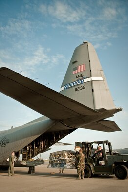 Ramp services troops load a pallet of cargo aboard a 123rd Airlift Wing C-130 at the Kentucky Air National Guard Base in Louisville, Ky., on Aug. 17. The aircraft is one of two from the wing that will be supporting Operation Joint Enterprise at Ramstein Air Base, Germany, through Sept. 5. The airlift mission supports U.S. military forces across Europe and Africa. Seventy-two Kentucky Air Guardsmen also are deloying for the mission. (U.S. Air Force photo by Maj. Dale Greer.)