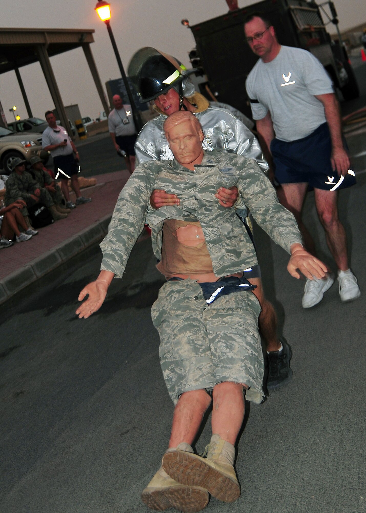SOUTHWEST ASIA -- Airman 1st Class Jerad Perea, 386th Expeditionary Force Support Squadron member, drags a dummy during a fire fighter challenge held at an undisclosed location in Southwest Asia August 16.  The fire fighter challenge was made up of five events including: the Hurst tool run, high rise pack run, forcible entry trainer, dummy drag and a charged hose line run to knock over objects.  Airman Perea is deployed from the 366th Force Support Squadron in Mountain Home AFB, Idaho .   (U.S. Air Force photo/Tech Sgt. Tony Tolley)